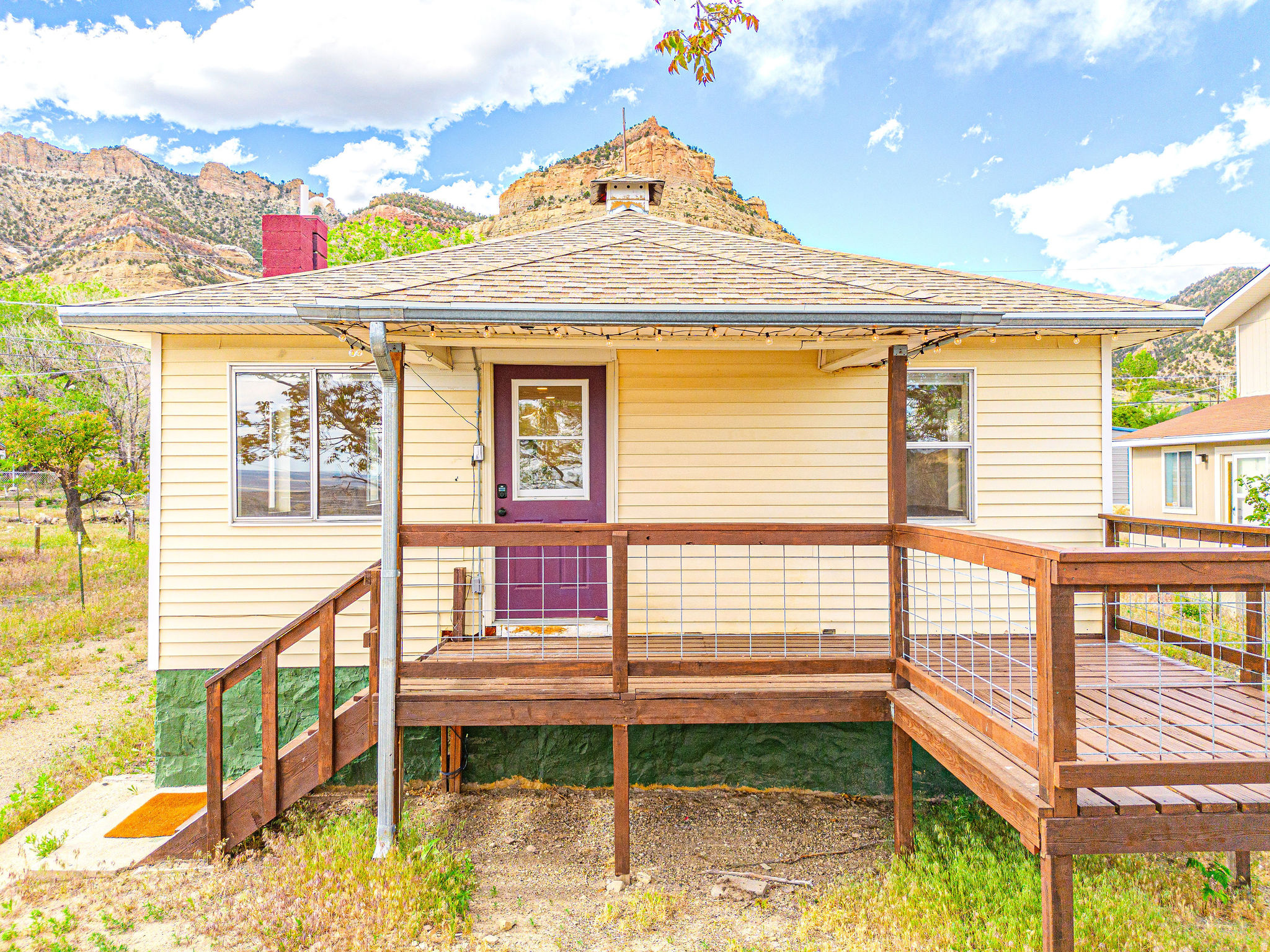 New price! If this house was on your 'favorites' list then right now is the perfect time to make a move and schedule an in person tour. Discover your perfect retreat in the peaceful town of Kenilworth, just minutes away from the stunning Book Cliffs of Utah. Whether you're looking for a cozy first home or a serene weekend escape, this move-in ready treasure is an opportunity you won't want to miss. Inside, you'll find beautifully restored wood floors that add character and warmth, complemented by thoughtful updates and custom touches that create a welcoming and comfortable living space. The generous backyard and inviting front porch provide the ideal setting to create your own desert oasis-perfect for stargazing, entertaining friends and family, gardening, or simply enjoying tranquility in a truly unique location. Make sure to seize the chance to call this charming home yours!   Square footage figures are provided as a courtesy estimate only and were obtained from County records.  Buyer is advised to obtain an independent measurement.