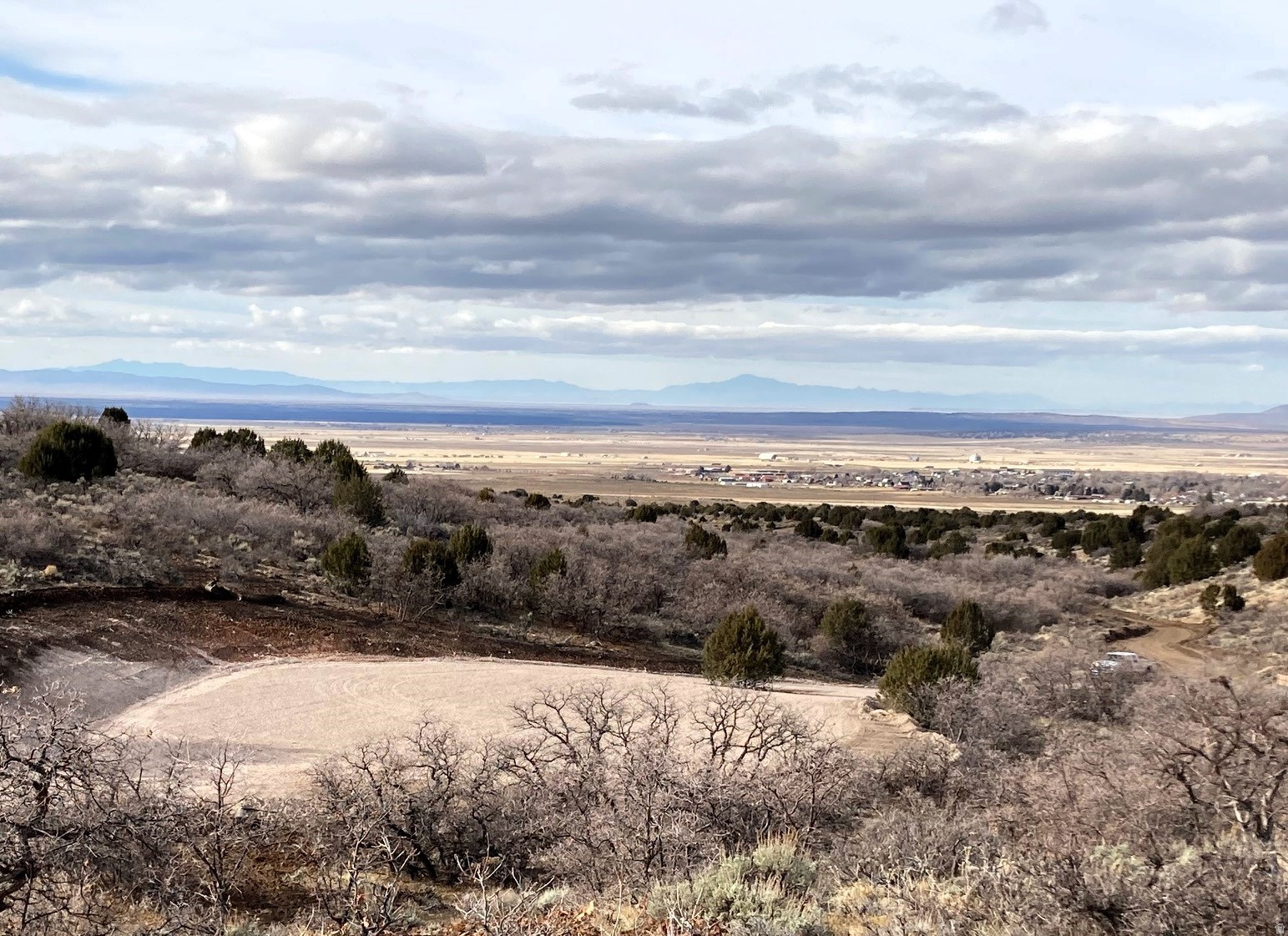 PRICE REDUCED. Escape to your own private slice of Utah wilderness heaven! This 60-acre wooded property sits in the rolling foothills just 5 minutes southeast of Fillmore Utah.  It offers a peaceful retreat with breathtaking mountain and valley views, and yet only a few minutes to Fillmore for groceries or golf.   With rolling terrain, wide-open views, and abundant wildlife-including deer, elk, and turkey-this property is ideal for a private retreat, recreational getaway, or future development. Close proximity to Fillmore and easy road access make it an excellent long-term investment with both personal use and resale potential.  A private gated entrance leads to a large, level camping area complete with a firepit, portable 225-gallon water tank, and a covered picnic canopy-ready for campfires, gatherings, or just relaxing under the stars. Also comes with a buried 650-gallon water tank on the hill with water spigot down by campsite that provides reliable water access, and a 20-foot Conex storage container to keep your gear secure.  A short ride takes you to the top of the Paiute Trail System and miles and miles of endless riding (motorcycle, ATV, UTV, Horses, Jeeps, etc.). To the west of Fillmore are countless other trails where you will see unique geological features like lava tubes and hot springs.  Private, peaceful, and ready to enjoy - your Utah mountain retreat awaits.  This place is truly amazing!!!  Summary of Features included:  A private gated entrance leading to a large, carved-out camping or building area A buried 600-gallon water tank with spigot for convenient water access An additional portable 225-gallon water tank for flexible use around camp A firepit and large covered picnic canopy, creating a perfect setup for gatherings and outdoor relaxation A 20-foot Conex storage container for secure onsite storage Abundant wildlife-deer, elk, turkey, and more frequently roam the area Easy access to town, yet quiet and secluded Whether you're looking for a recreational getaway, hunting base, or future cabin/home site, this property delivers the best of both worlds-convenience and wilderness. Buyer to verify all information.