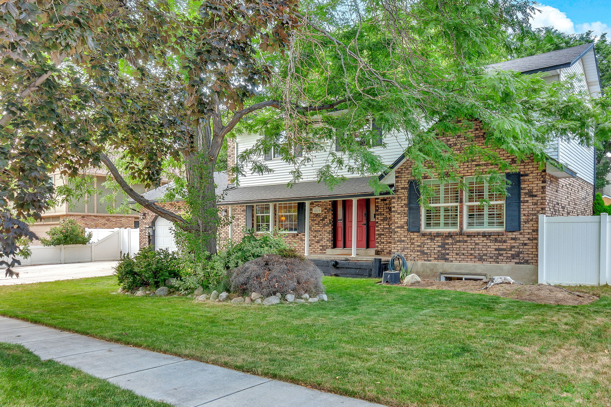 Homes like this don't come along often! This beautifully maintained home features a full brick exterior on the main level, mature landscaping, and a peaceful backyard sitting area that's perfect for relaxing or entertaining. Step inside to an inviting open-concept kitchen and great room, creating the ideal space for everyday living and gatherings. The stunning kitchen is highlighted by granite countertops, ample workspace, and timeless finishes. The spacious primary suite offers exceptional storage with a large walk-in closet plus two additional closets. The bright, spa-like primary bathroom features an expansive walk-in shower-a rare find in Sandy. Be sure to check out the upgraded dream garage, complete with built-in cabinets that are included with the home, providing outstanding organization and storage. This move-in-ready home has been lovingly cared for and is ready for its next owner. Don't miss your opportunity to make this exceptional property your own!