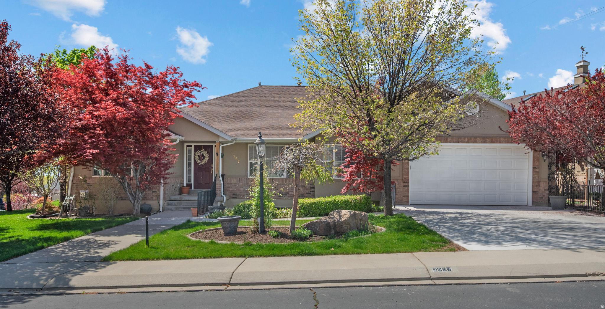 Beautifully maintained custom home in one of Cedar Hills' most desirable, quiet neighborhoods-featuring mountain views, and a serene, park-like setting. The fully landscaped yard includes mature trees, fruit trees, and a charming stream flowing through an intimate garden area between the home and the detached shop/garage. All rain gutters on the home and garage have Leaf Guard. The 2-story, 2,240 sq ft main floor garage/ upstairs shop (28' x 40' footprint) offers a 4-car garage below and versatile upstairs space-perfect for additional shop use, hobby storage, home office, workshop, or future apartment conversion (subject to permits). There's an additional storage shed in the backyard. Dedicated RV parking makes this one-of-a- kind property ideal for hobbyists, collectors, mechanics, or anyone needing serious storage and workspace. Inside, an open, entertaining-friendly layout features a spacious family room flowing seamlessly from the kitchen and dining area. The kitchen opens to a generous deck-great for BBQs and enjoying spectacular sunsets. The luxurious owner's suite is privately located at the rear with direct deck access, complemented by a home office, guest bedroom, full bath, laundry, half bath and central vac system. The fully finished basement provides incredible versatility: a second full kitchen, family room, three additional bedrooms, full bath, dedicated gym, and another half bath-ideal for multigenerational living, guests, in-law suite, or recreation. Dual water heaters ensure you'll always have a hot shower. Prime location: minutes from Heritage Park, Harvey Park, and the scenic Cedar Hills Trail connecting to the renowned Cedar Hills Golf Course. Multiple parks, trails, and community amenities support an active, family-oriented vibe, with shopping, restaurants, and conveniences nearby. A rare blend of luxury, functionality, and unmatched potential in a highly sought-after Cedar Hills neighborhood. All info provided as a courtesy - buyer or buyer's agent to verify.