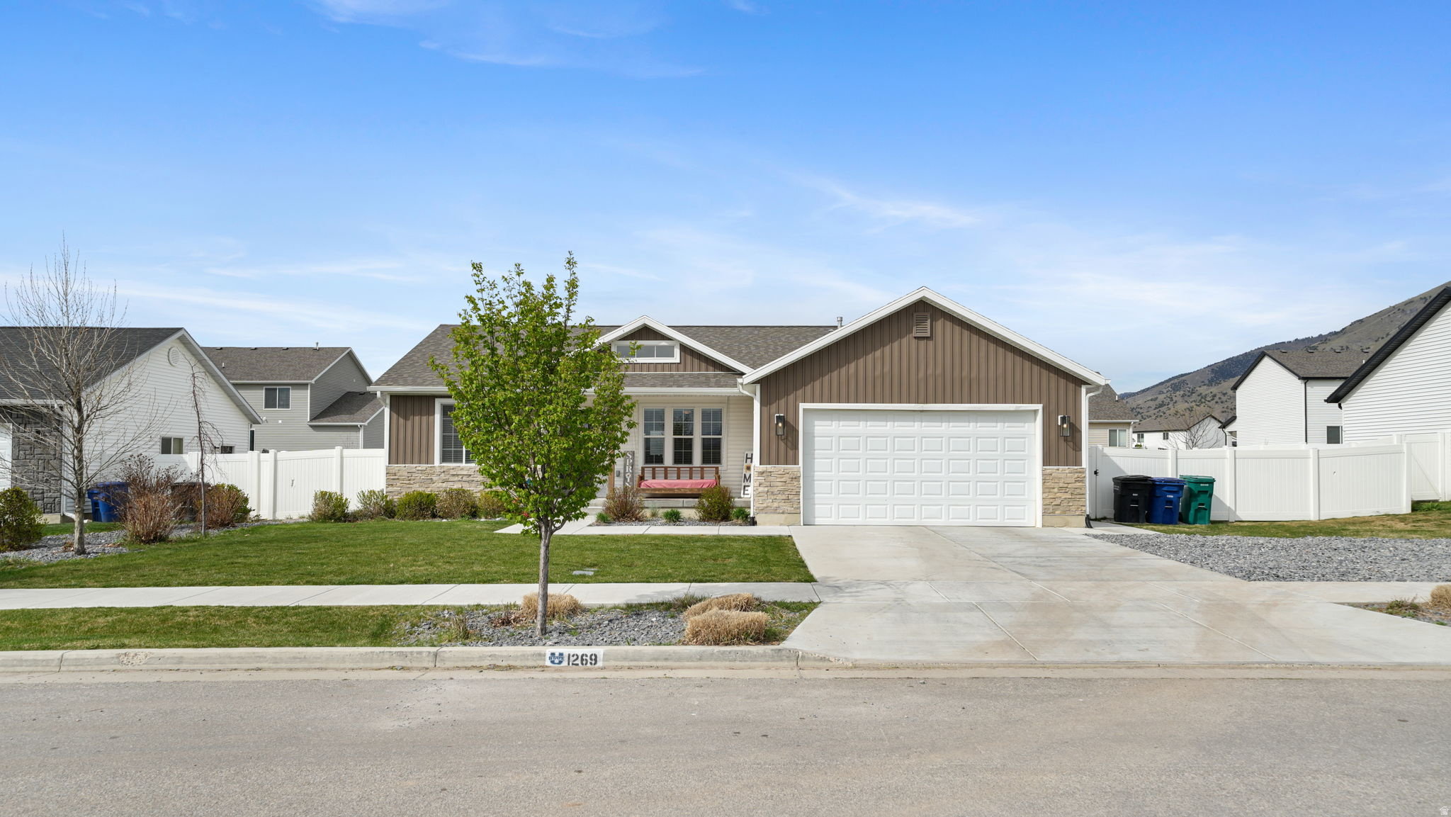 Modern, clean, and income producing, this 2020 built rambler in Mountain View Estates checks all the boxes. With over 2,600 square feet, 5 bedrooms, and 3 bathrooms, this home offers both comfort and versatility, including a fully finished basement apartment with private entrance, kitchen, and laundry hookups. Tenant just moved out, was operating as a rental at $1450 a month, it's a turnkey opportunity for additional income, multigenerational living, or private guest space. The main level is bright and open, designed for both everyday living and entertaining. The kitchen features a gas range, black stainless steel appliances, and a seamless flow into the living and dining areas. The spacious primary suite offers a walk-in closet and private bath.  Set on a fully landscaped quarter acre lot, the backyard is built for enjoyment with an extended concrete patio, in ground trampoline, and a 15x20 storage shed for all your storage and hobby needs. Energy Star certified with central air, gas heating, water softener and no HOA. Square footage provided as a courtesy estimate from county records. Buyer to verify.