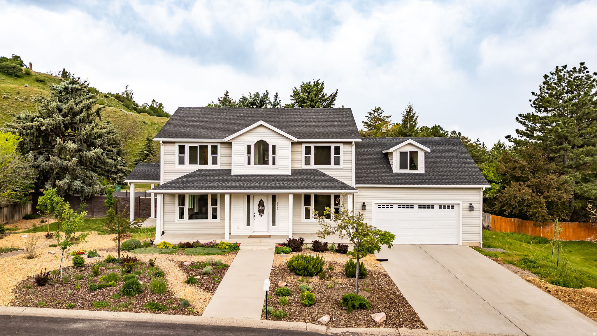Welcome to this beautiful home in the highly sought after Thrushwood/Sumac area.  It offers a perfect blend of space, comfort, and charm which makes everyday living and entertaining effortless.  This stunning home features 6 bedrooms, including a peaceful primary suite with amazing mountain views,  3 1/2 bathrooms, and 2 family rooms.  Secluded in the Hidden Village subdivision and tucked away with very little traffic, you get peace and quiet with amazing mountain views.  Step outside and you're just minutes away from some of the best running, hiking, and biking trails in Cache Valley while still being close to schools, parks, shopping, and Historic Downtown Logan.  Opportunities like this don't come along often.  Don't miss your chance to own this peaceful retreat in a wonderful location. Buyer to verify all information.