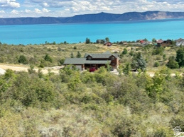 Make your move to Bear Lake, this building lot has stunning views, mature trees, gradual sloped lot to keep your forever view of Bear Lake. Lot is improved with stubbed culinary water, sewer & power. Lot was surveyed corners were in evidence. Enjoy the amenities of 9 home golf course, with owner discount, Bear Lake Access, tennis/ pickleball court, summers outdoor heated pool for owner. NO Short term rentals allowed in this HOA.
