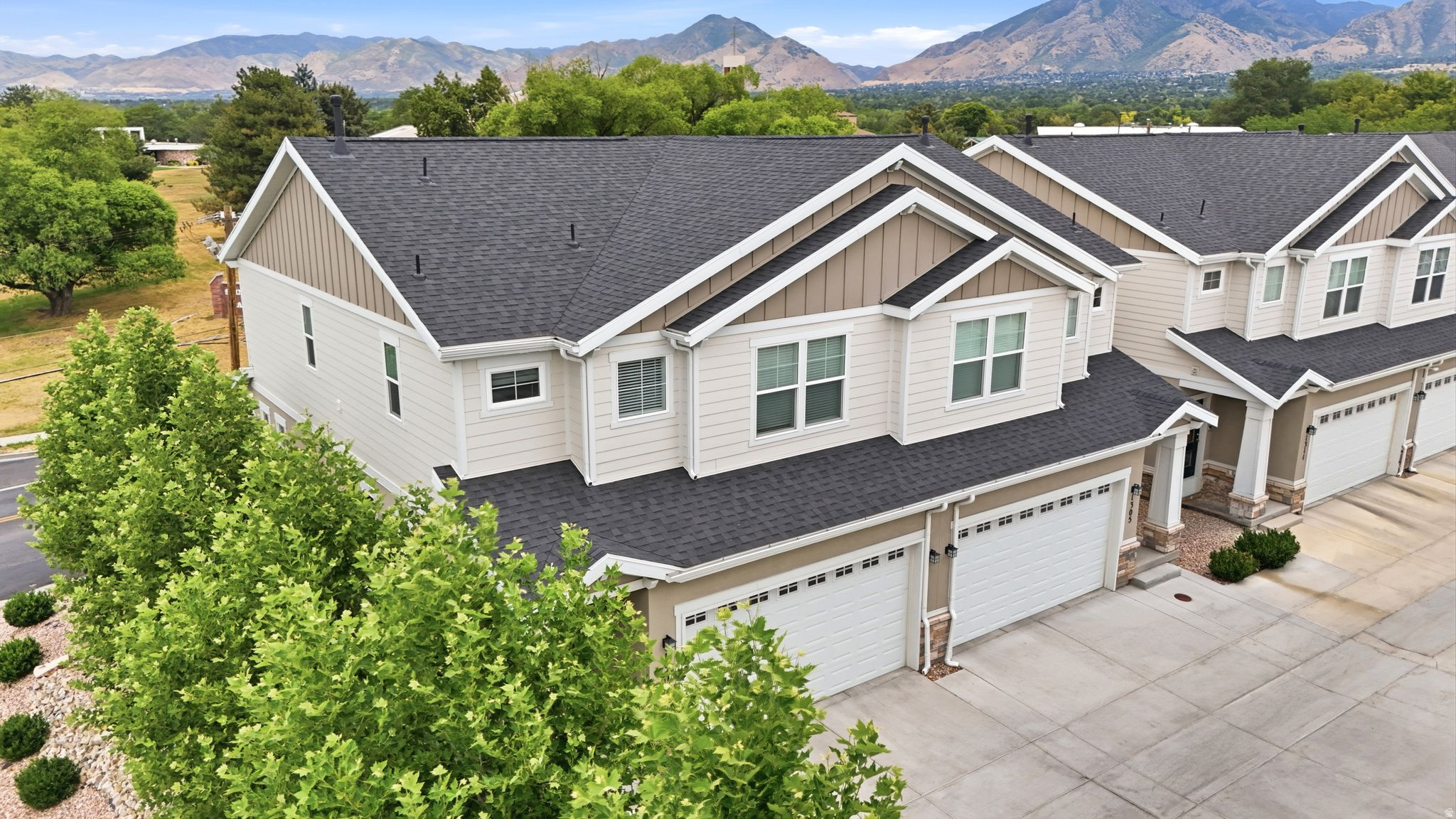 Discover refined living in this beautifully designed townhome in the desirable Weyburn Pointe community of Holladay. Ideally located just minutes from premier shopping, dining, scenic hiking and biking trails, and world-class ski resorts, this home also offers stunning views of Mount Olympus. The thoughtfully designed open-concept floor plan blends modern style with everyday functionality. Interior finishes include durable LVP flooring on the main level, tile flooring in the bathrooms and laundry room, quality Moen fixtures, and window coverings throughout. Built for year-round comfort, the home features dual furnaces and air conditioning units, a 96% high-efficiency furnace, a 50-gallon gas water heater. Outside, enjoy a spacious two-car garage along with fully fenced, professionally landscaped front and back yards, providing a private outdoor retreat. Combining quality finishes, an unbeatable location, and low-maintenance living, this exceptional home is one you won't want to miss.