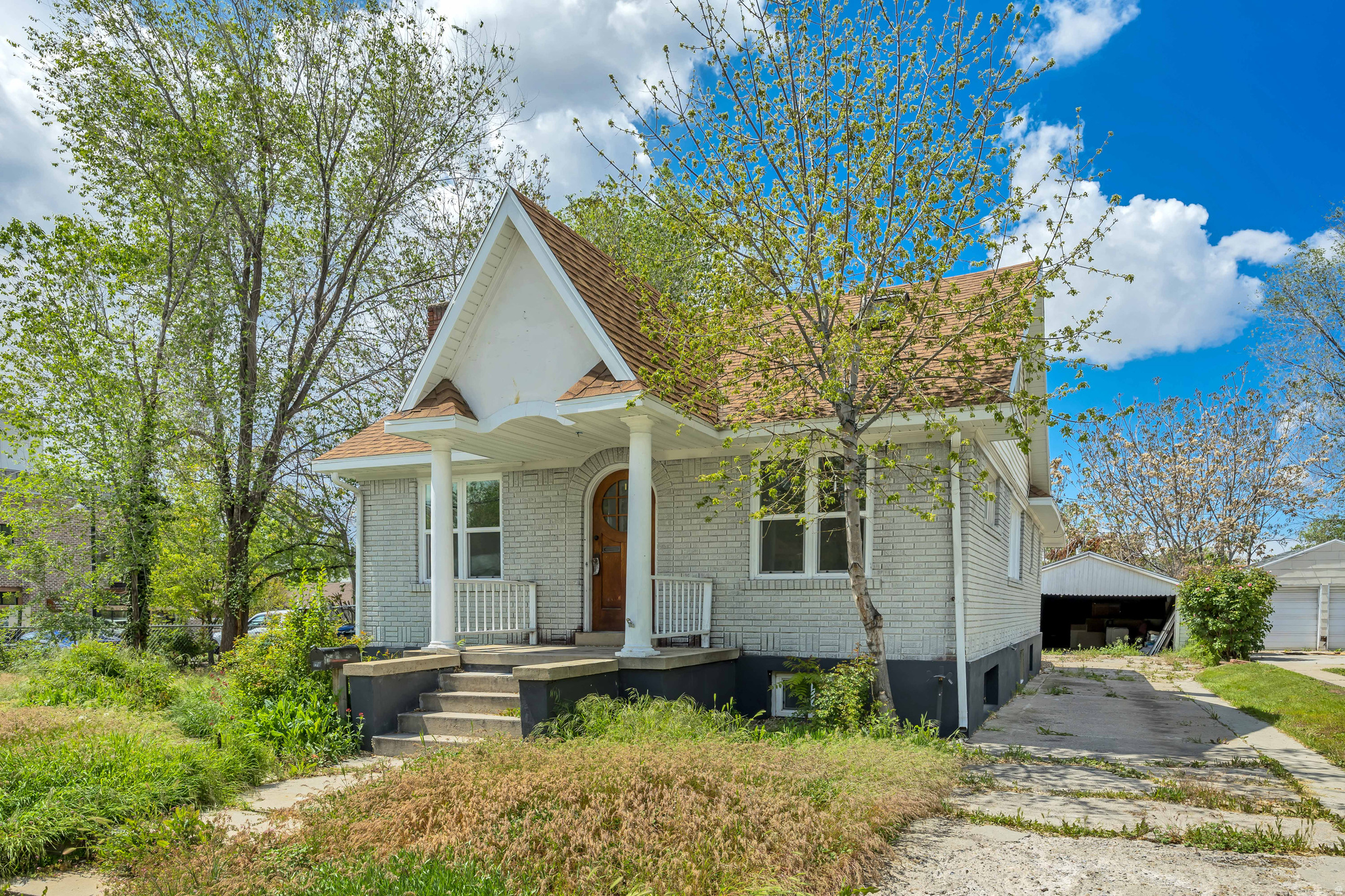 Charming Tudor-style home in the heart of Salt Lake City featuring 5 bedrooms, 2.5 bathrooms, and nearly 2,000 sq ft above grade with a 1,100 sq ft basement. This home blends classic character with modern basement ideal for a mother-in-law setup or rental potential. Situated on a 0.17-acre lot with a functionality and many updates throughout. Enjoy a spacious layout, two fireplaces, and a finished secluded yard in an amazing central location near downtown and local amenities.