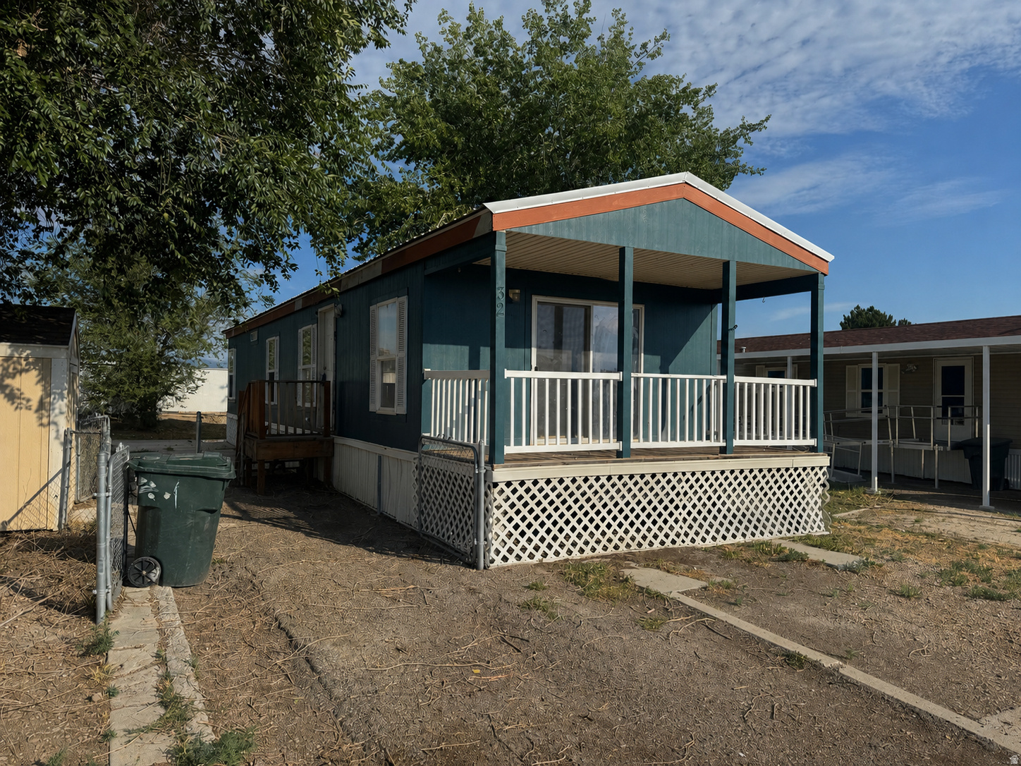 Charming & Affordable Living in Lila Canyon Estates with this  2-bedroom, 1-bath mobile home. This home offers a comfortable and functional layout with thoughtful features throughout. Step inside to find a spacious kitchen with a center island, perfect for meal prep, casual dining, or gathering with friends and family. The cozy living area is highlighted by a fireplace, creating a warm and inviting atmosphere. The home also features a large soaker tub in the bathroom-ideal for relaxing at the end of the day. Enjoy your morning coffee or unwind in the evening on the front balcony with sliding glass door access, adding a great indoor-outdoor living element. Additional highlights include a durable metal roof, fully fenced yard ready for pets, and a storage shed for added convenience.  Please note: This is a mobile home only sale- lot is not included.  Current lot rent is $435/month.
