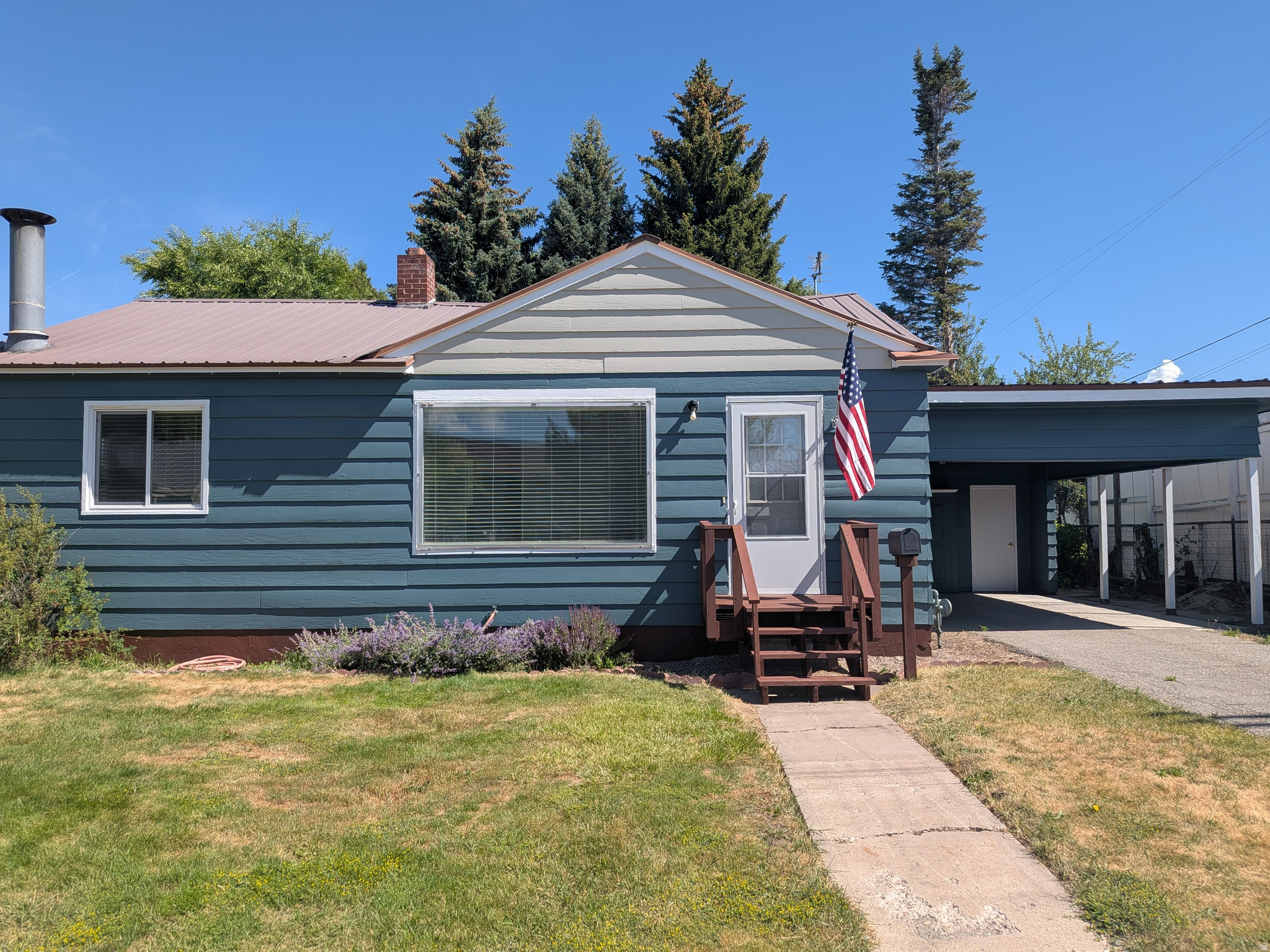 Price Reduced $15,000.00!!! Plus, New Exterior Paint and New Deck. This Adorable 3-bedroom, 2-bath home situated on a beautiful lot with mature trees and plenty of outdoor space to enjoy. The backyard features a garden area, a brand-new shed, and a spacious deck just off the kitchen and dining area-perfect for entertaining or relaxing evenings at home. Inside, you'll love the brand-new appliances, fresh paint throughout, a cozy wood-burning stove, and newly remodeled bathrooms. A carport adds convenience, and the seller is offering a paint allowance for the exterior, giving you the opportunity to add your own finishing touch!  Square footage figures are provided as a courtesy estimate only and were obtained from Bear Lake County .  Buyer is advised to obtain an independent measurement.