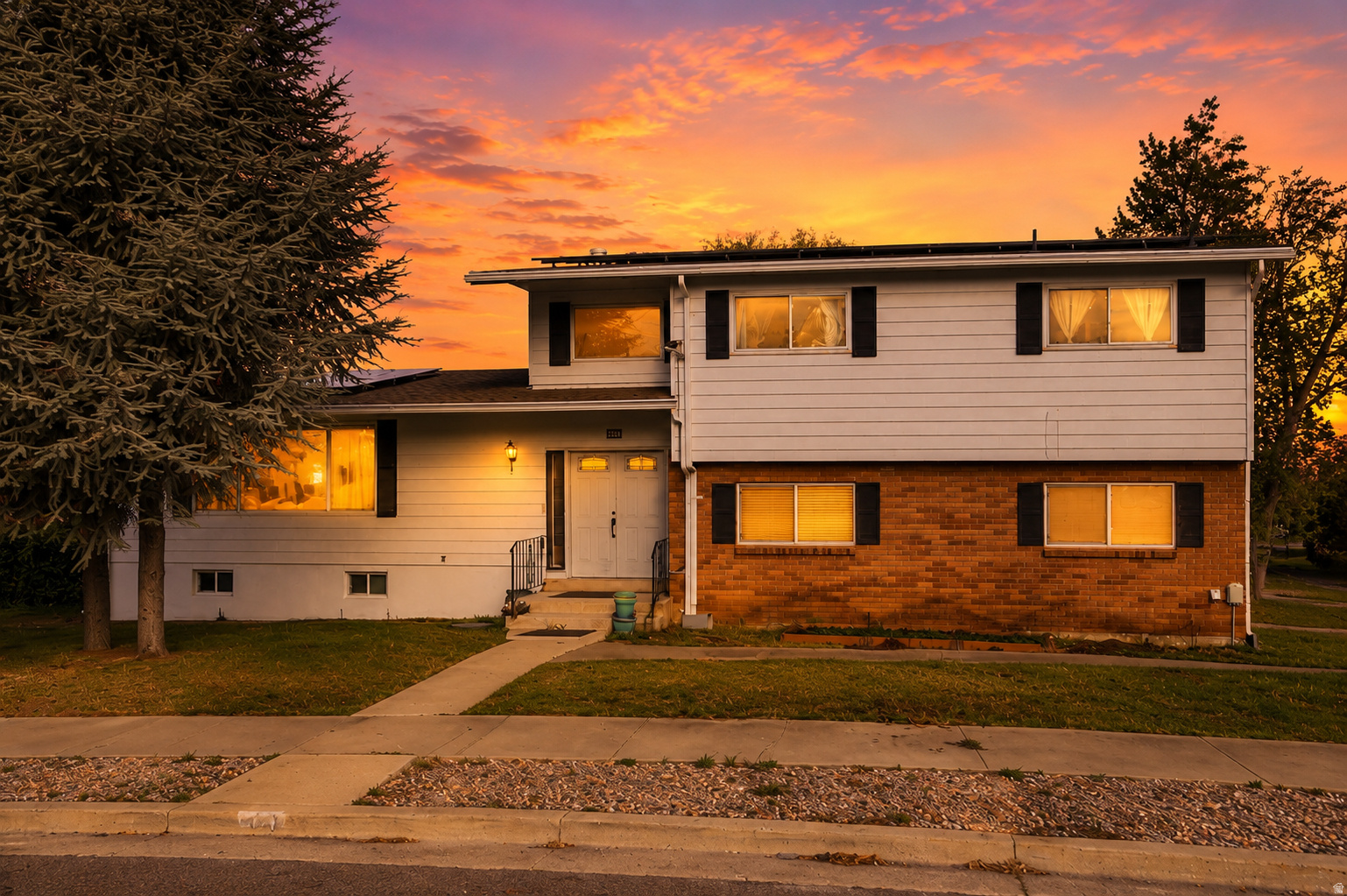 ***Assumable Loan 4%***Price  Improvement!! Welcome to this spacious South Ogden home featuring beautiful mountain views and a versatile floor plan designed for comfortable living. Offering 4 bedrooms and 3.5 bathrooms, this home includes three separate living areas plus a bright sunroom, providing plenty of space for a variety of needs.  The main-floor laundry adds convenience, while the updated kitchen showcases an impressive 11-foot granite island, cherry cabinetry, and abundant workspace. All bathrooms and the kitchen have been updated within the past 510 years.  Major system updates include paid-off solar panels, a newer roof installed at the same time as the solar system, a furnace and air conditioning condenser that are less than 10 years old, and a water heater replaced in the last year. New carpet has been installed throughout the home, and the fully finished basement offers additional living and entertaining space.  Step outside to enjoy the Trex deck, added approximately seven years ago, perfect for outdoor dining and gatherings while taking in the mountain views.  Conveniently located near shopping, healthcare facilities, Weber State University, Hill Air Force Base, and with easy access to Highway 89, this well-maintained home combines space, updates, and an excellent location.
