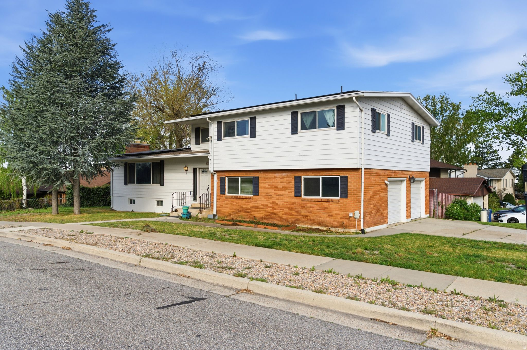 Welcome to this spacious South Ogden home featuring beautiful mountain views and a versatile floor plan designed for comfortable living. Offering 4 bedrooms and 3.5 bathrooms, this home includes three separate living areas plus a bright sunroom, providing plenty of space for a variety of needs.  The main-floor laundry adds convenience, while the updated kitchen showcases an impressive 11-foot granite island, cherry cabinetry, and abundant workspace. All bathrooms and the kitchen have been updated within the past 510 years.  Major system updates include paid-off solar panels, a newer roof installed at the same time as the solar system, a furnace and air conditioning condenser that are less than 10 years old, and a water heater replaced in the last year. New carpet has been installed throughout the home, and the fully finished basement offers additional living and entertaining space.  Step outside to enjoy the Trex deck, added approximately seven years ago, perfect for outdoor dining and gatherings while taking in the mountain views.  Conveniently located near shopping, healthcare facilities, Weber State University, Hill Air Force Base, and with easy access to Highway 89, this well-maintained home combines space, updates, and an excellent location.