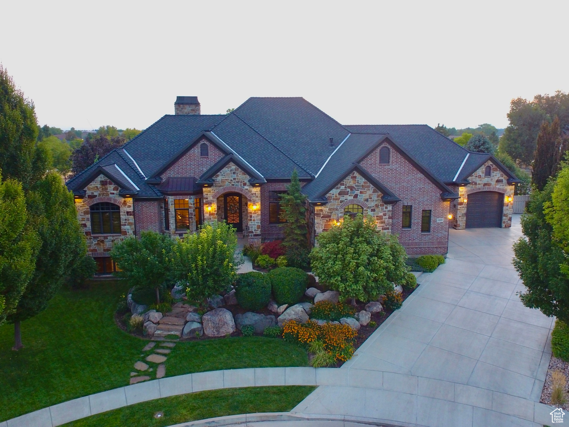 Welcome to a custom-built masterpiece, an 8,473 sq. ft. estate that redefines luxury living at its finest. From the moment you step inside, you are surrounded by an air of bespoke craftsmanship and unparalleled design. Every detail, from the iron and glass front door to the custom lighting and exquisite finishes, has been meticulously curated to create a truly one-of-a-kind home. The intelligent, free-flowing layout was designed for both grand-scale entertaining and intimate family living. Indulge in the gourmet chef's kitchen, retreat to the spa-like master suite, or be captivated by the unthinkable amenities. Beyond the walls of this magnificent residence, a private oasis awaits, where lush landscapes and a custom-built 44' x 20' pool create a seamless transition between indoor and outdoor living. This is more than a home; it is an exceptional and exclusive living experience. (A detailed list of the extensive features is available upon request. Also, a link to a video fly-through tour and a 3D tour are attached.)