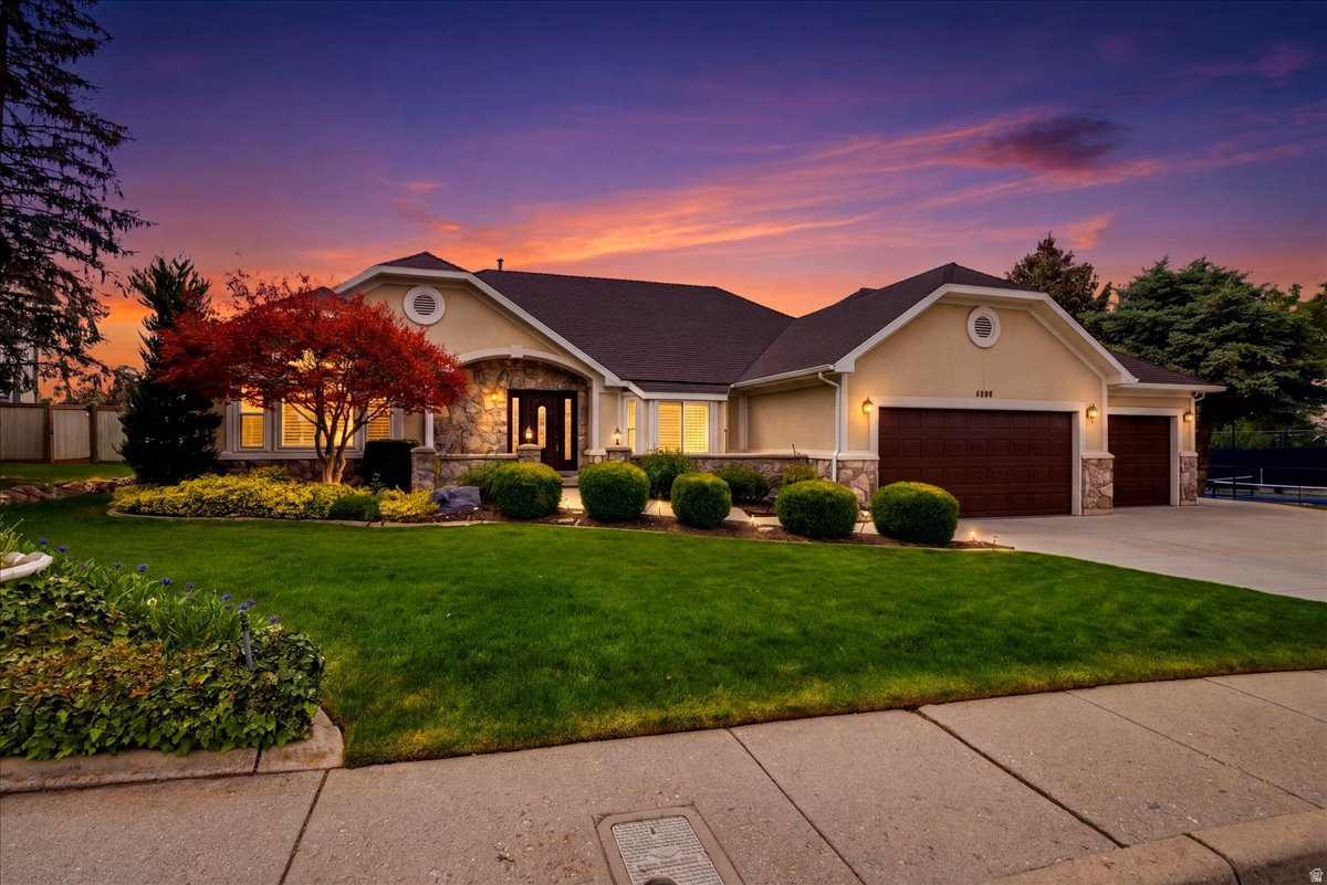 One-level living, updated interiors, and sweeping Wasatch Mountain views are just the start for this amazing home. Set on a .30 acre lot near ski resorts and Willow Creek Country Club, it delivers space, comfort, and everyday functionality in a highly sought after location. This 5-bed single-family home is designed for easy living and entertaining. The main floor features a spacious family room with built in cabinetry and vaulted ceilings, creating an open and inviting central gathering space. The kitchen offers newer cabinets, updated countertops, a pantry, bar seating, and space for a kitchen table, making it ideal for both daily living and hosting. A formal dining area adds flexibility for larger gatherings, while two fireplaces bring warmth and character. The owner's suite is generously sized with room for seating and includes a walk in closet. The en suite bathroom features heated flooring for added comfort. Main floor laundry and a functional mud room enhance everyday convenience. Set on a professionally landscaped .30 acre lot, the backyard is built for enjoyment with a large covered patio perfect for outdoor entertaining, an in-ground trampoline, expansive yard space, and a Tuff Shed with power. There is also a basement entrance. A 3 car garage provides ample storage. HOA amenities include tennis/ pickleball courts. Located minutes from world class ski resorts with breathtaking Wasatch Mountain views, this home offers an ideal blend of space, upgrades, and location.