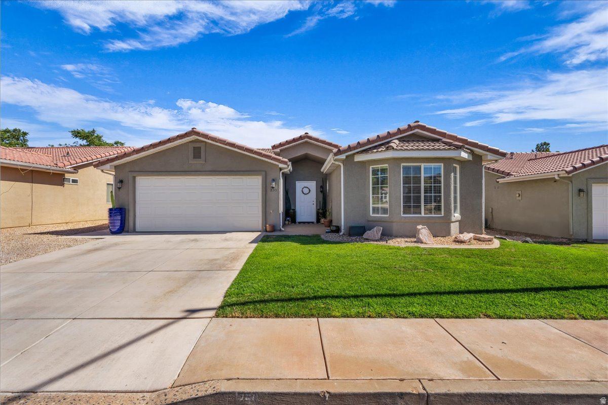 Move-in ready and beautifully updated, this 3-bedroom, 2-bath home offers the perfect blend of comfort and convenience. Vaulted ceilings and an open layout create a bright, spacious atmosphere filled with natural light. Step outside to the covered patio, an ideal space for relaxing or entertaining year-round. Located in an unbeatable Southern Utah location, you'll be just minutes from scenic hiking and biking trails, Quail Creek and Sand Hollow Reservoirs, Green Spring Golf Course, Coral Canyon Golf Course, shopping, dining, and everyday amenities. Whether you're looking for a full-time residence, second home, or investment property, this home offers exceptional value in the heart of outdoor recreation.