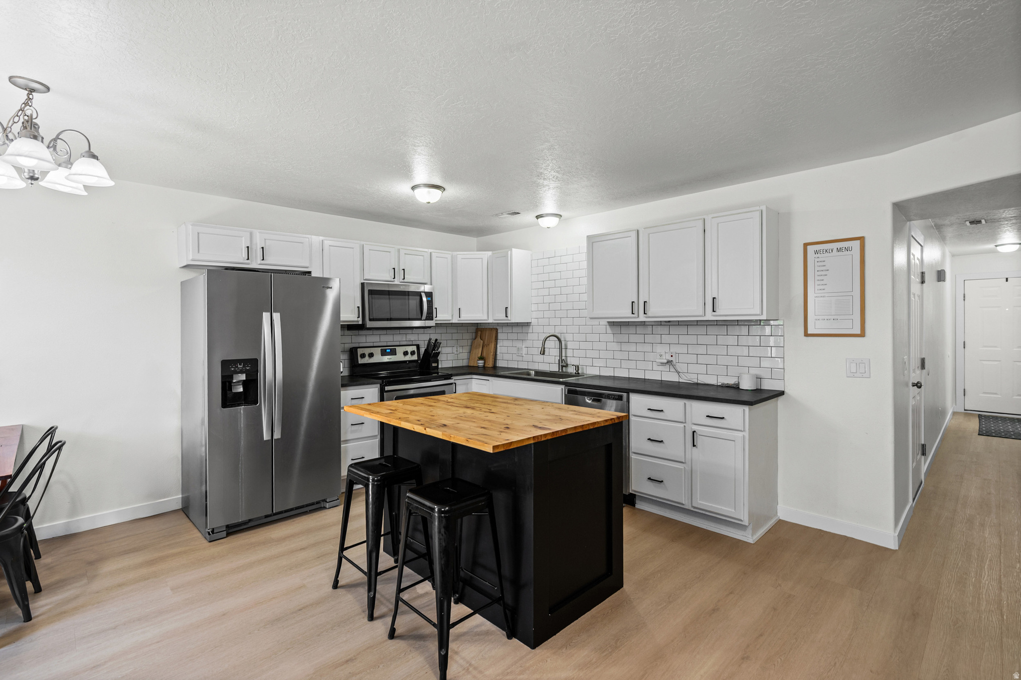 Open house Saturday, July 18th 11-2. Sellers offering 5k for potential rate buy down! You don't want to miss this one! Perfect for first time buyers, with all major systems updated including AC, furnace, and water heater. Well maintained, cared for, improved, and move-in ready. This townhome is in a prime Lehi location, with incredible commuter access to I -15 at a great value. It has been beautifully updated throughout, including new flooring, stainless steel appliances, and a custom butcher block island. It offers an open-concept layout with 3 bedrooms and 2.5 bathrooms. Upstairs you'll find a large primary suite with a walk-in closet as well as a large master bathroom with a jetted tub. The location is hard to beat with shopping, restaurants, skiing, and Thanksgiving Point nearby. It is tucked into the desirable Country Lane community, where residents enjoy access to a clubhouse and playground. HOA includes landscaping, trash, and snow removal. Square footage figures are provided as a courtesy estimate only and were obtained from county records.  Buyer is advised to obtain an independent measurement.