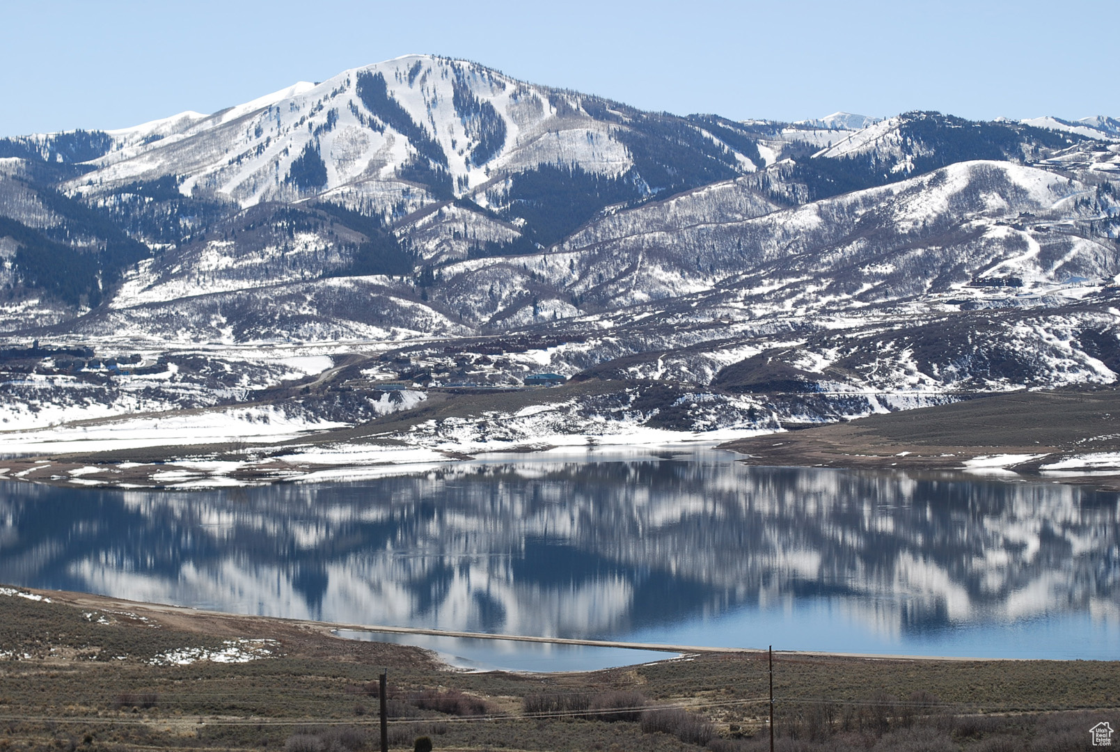 Relish in the breathtaking beauty of the Jordanelle lake and Deer Valley Ski Resort mountain views from the dream home you have always wanted to design for this stunning lot in Hideout, Utah. Wake up every day and look out across the Jordanelle Lake to the slopes of Deer Valley Ski Resort & check out the weather for ski conditions or flat water for a smooth wake board adventure. Only a 10 minute drive to Park City, and you're just a few minutes to the Jordanelle State Park in the Summer and Deer Valleys Deer Crest Gondola in the winter. Close to the New Mayflower Resort Area for year-round enjoyment. Beautiful sunny lot in a great neighborhood where you can build your primary residence or vacation home. This secluded gated community is perfectly positioned between all that Park City has to offer to the west, and horse farms to the east. This Reflection Ridge homesite allows for a home to be built between 3500 to 5500 square feet. An active Design Review Committee ensures your neighbors will build delightful homes as well. READY TO BUILD! Geo Report and Topography Report are available. Buyer required to pay a 1.25% transfer fee to the HOA upon closing and a $100 HOA set up fee. Buyer to pay an annual $3379.43 utility bond through 2036. This amount is included in the yearly property taxes posted on the MLS.
