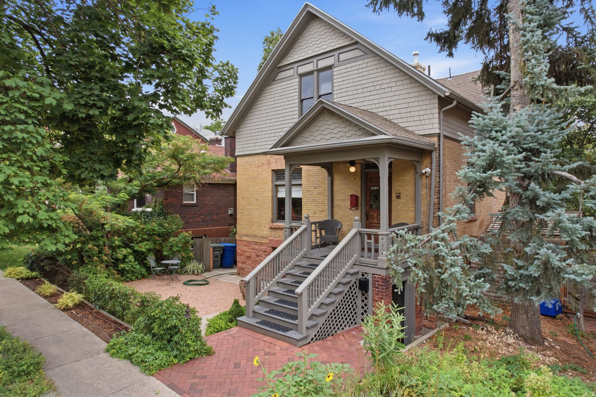 This beautifully updated historic home in the coveted Avenues neighborhood blends timeless craftsmanship with modern living. Original woodwork, soaring ceilings, and elegant gathering spaces showcase the home's character, while the updated kitchen and remodeled bathrooms offer the comfort and convenience today's buyers expect. Enjoy your morning coffee in the bright sunroom or host friends on the spacious deck overlooking the fully fenced backyard with mature landscaping. Alley access provides exciting future potential for a garage or additional improvements. The finished walkout lower level offers exceptional versatility with its own living area; perfect for guests, multigenerational living, a private home office or studio, or the possibility of rental income. Just minutes from the University of Utah, downtown Salt Lake City, neighborhood parks, acclaimed restaurants, shopping, hiking trails, and public transportation, this location offers the best of historic charm and urban convenience with outstanding walkability. Homes that combine authentic historic character, thoughtful updates, flexible living space, and one of Salt Lake City's most desirable locations rarely become available. This is a unique opportunity to own a home that is as timeless as it is functional. Ask about the rental income possibility from the basement rental.