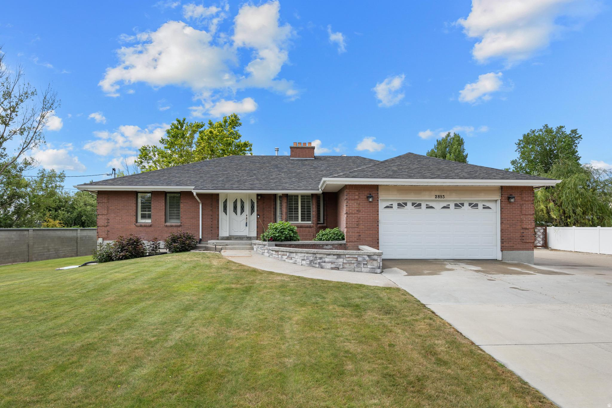 LOVE WHERE YOU LIVE Rare opportunity to own a versatile 1.90-acre property featuring a spacious 3,576 sq ft single-family home with 5 bedrooms and an attached 2-car garage. The property includes an impressive 40' x 60' shop with 240-volt power, 16' sidewalls, and three 14' x 14' overhead doors, providing ample space for equipment, vehicles, RV storage, hobbies, or business use. Additional improvements include a 15' x 60' covered awning, a 24' x 54' cinderblock barn with second level, and a covered breezeway connecting structures.  Well water serves the property. The acreage offers flexibility for agricultural, livestock, or hobby farm use, with capacity for approximately 2 large animals, 5 medium animals, or 20 small animals per half acre. Potential subdivision opportunity adds future value and development possibilities (buyer to verify zoning, subdivision requirements, and all intended uses).  A rare combination of acreage, residential space, substantial outbuildings, and development potential in one property. Home has new flooring, paint, lighting and countertops. All measurements and square footage are provided as a courtesy and are not guaranteed. Buyer to verify all information