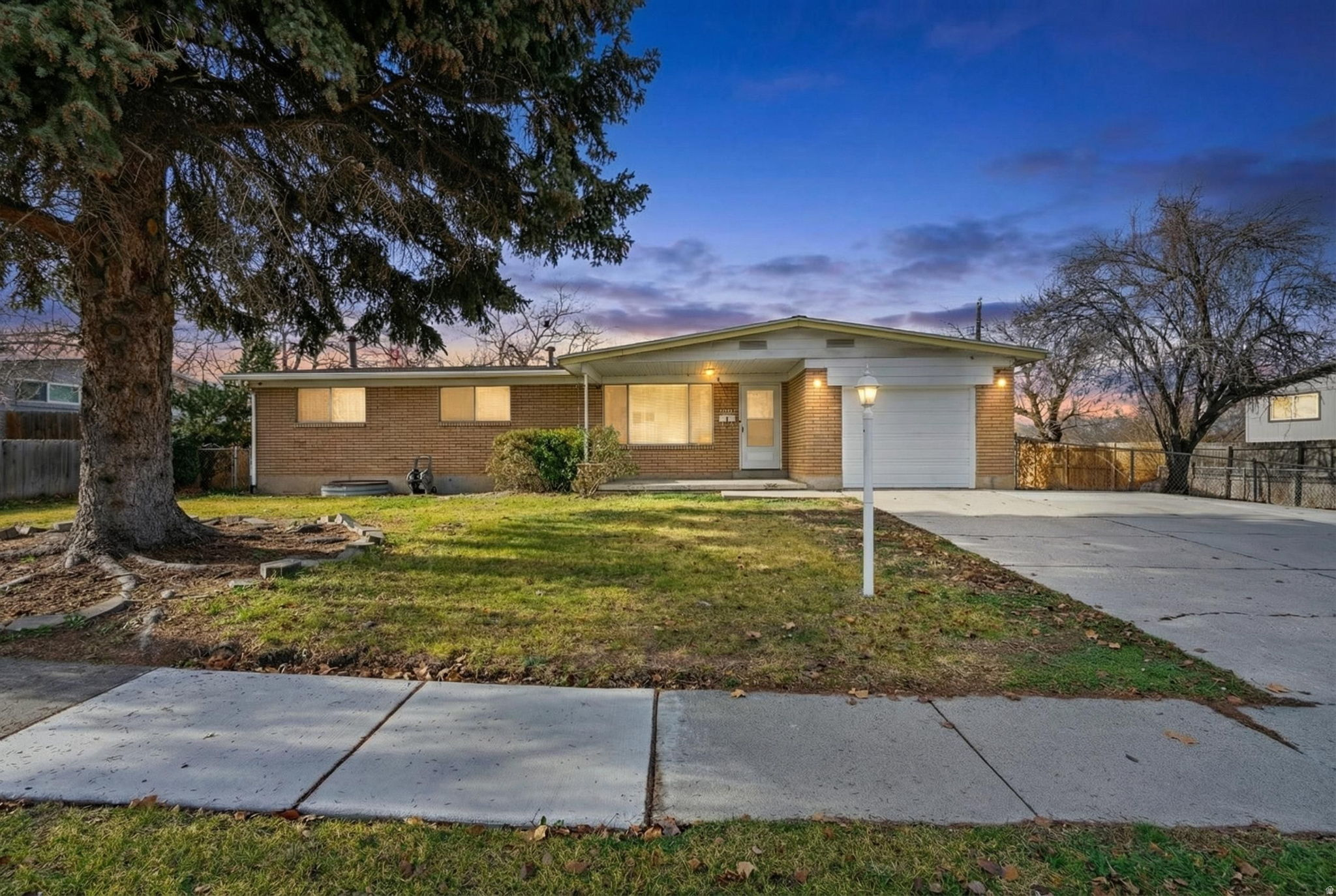 Seller will consider seller financing, offering a rare opportunity for added flexibility. Lowest-priced turnkey home in Cottonwood Heights, priced to sell quickly and delivering exceptional value with extensive updates throughout.  This well-maintained home provides immediate equity and long-term peace of mind, featuring a beautifully updated kitchen with new countertops, a stainless steel farmhouse sink, new dishwasher, cooktop, and modern lighting, along with brand-new recessed lighting throughout.  Major system upgrades include a 50-year roof (2024), new water heater (2025), and A/C and furnace (2021). Additional improvements include brand-new egress windows with wells and grates (2025), an updated electrical panel, PVC plumbing, and fully remodeled bathrooms on both levels.  The exterior is equally impressive with a stamped and glazed concrete patio, new driveway, RV parking with an additional pad, updated fencing, new gutters, and a fully replaced sprinkler system (2024).  Inside, enjoy beautiful hardwood floors upstairs and a bright, versatile basement featuring wood-look tile, added heating, and natural light-ideal for a second living area, home office, or guest space.  Situated in a quiet, walkable neighborhood near shopping, grocery stores, schools, and local amenities. Easy to show-schedule your private tour today.