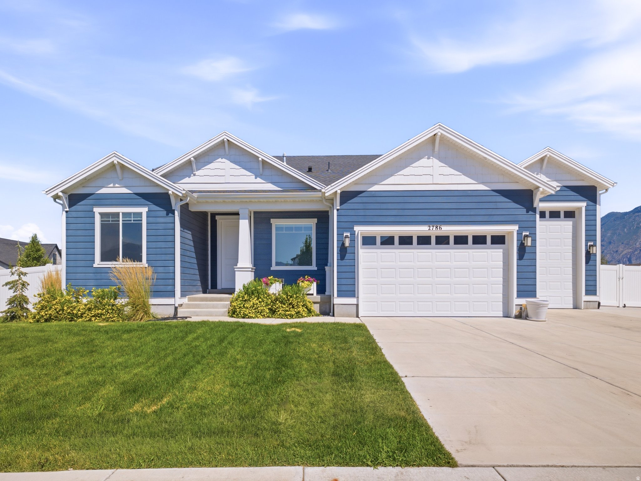 Welcome to this exceptional Mapleton Grove rambler, where thoughtful upgrades, stunning mountain views, and room to grow come together on a beautifully landscaped corner lot. Inside, you'll find an open and inviting floor plan featuring updated flooring, abundant natural light, and a beautifully appointed kitchen with upgraded cabinetry, ample storage, a large island, double wall ovens, and a gas range. The spacious main-level primary suite offers comfort and privacy, while the dedicated office and additional bedrooms provide flexibility for work and everyday living.  The full unfinished basement offers endless possibilities to customize the home to fit your needs, whether you're dreaming of additional living space, a home theater, gym, or future ADU potential (buyer to verify). The extra-deep, extra-tall garage provides outstanding space for larger vehicles, recreational equipment, and storage.  Step outside to enjoy a fully landscaped and fully fenced backyard designed for both relaxation and functionality. Raised garden boxes, an extended concrete RV pad that continues behind the fence for additional parking and storage, and a covered patio make this outdoor space truly exceptional. Surrounded by breathtaking mountain views and located in one of Mapleton's most desirable neighborhoods with community pool access, parks, and nearby hiking and biking trails, this home offers the perfect balance of luxury, convenience, and future potential.