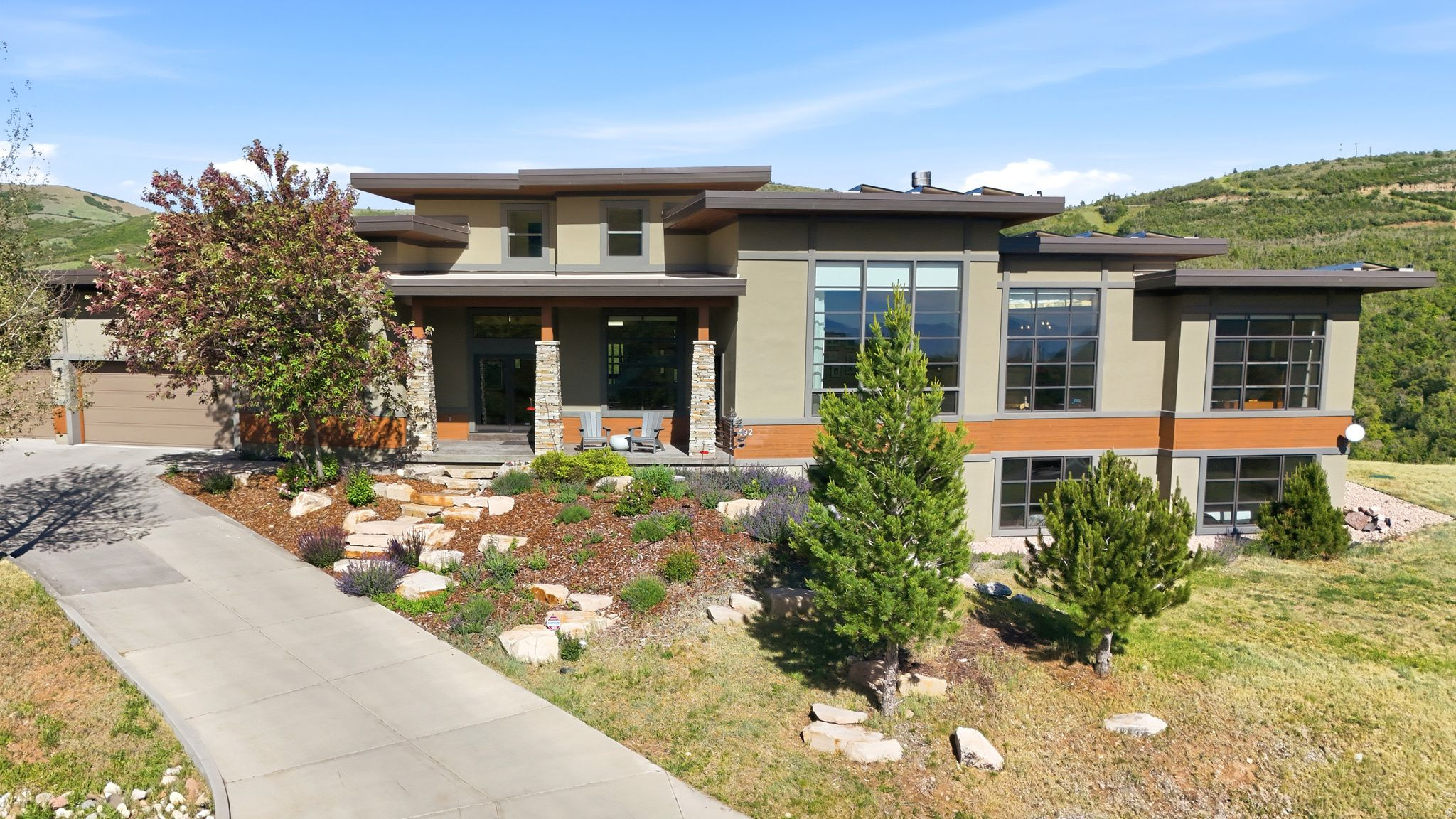 Perched on 1.69 private acres in the foothills of Emigration Canyon, this stunning mountain modern retreat offers an exceptional blend of luxury, privacy, and convenience. Surrounded by sweeping panoramic views in every direction, the home captures the beauty of the Wasatch Mountains and the valley below, creating a setting that feels remote and serene while remaining remarkably close to the city. Featuring 5 bedrooms and 7 bathrooms (5 full and 2 half), the residence is thoughtfully designed for both everyday living and effortless entertaining. Each bedroom enjoys the privacy and comfort of its own en suite bath, with all five suites offering a shower and toilet, and three featuring soaking tubs. One guest suite includes a private sauna, while the luxurious primary suite is highlighted by an oversized soaking tub, creating a spa-like retreat ideal for unwinding after a day spent hiking, skiing, or enjoying the outdoors. Expansive windows frame the surrounding landscape, filling the home with natural light and showcasing breathtaking vistas from nearly every room. Modern upgrades enhance both comfort and efficiency, including solar power and new roof in 2021, a brand-new HVAC system installed just two months ago, a tankless water heater, Radon Mitigation system, Heated Garage, Steam shower, and an upgraded broadband internet system designed to maximize connectivity and performance while maintaining the peaceful character of mountain living. Generous living spaces, refined finishes, and a seamless connection to the outdoors create an atmosphere that is both sophisticated and inviting.    Set among the natural beauty of Emigration Canyon, the property offers direct access to private trails connecting to several nearby hikes, allowing adventure to begin right from your doorstep. Wildlife, spectacular sunsets, and endless views create a daily backdrop, while the remarkable quiet of the area provides a level of tranquility rarely found so close to a major city. In fact, some consider this to be the quietest neighborhood on the Wasatch Front. Despite its secluded feel, downtown Salt Lake City, world-class dining, shopping, and cultural attractions remain within easy reach. In approximately 15 minutes, you can be out of the canyon and connected to everything the city has to offer. Park City and some of Utah's most celebrated ski resorts, hiking trails, restaurants, and year-round recreational amenities are also just 25 minutes away, placing world-class outdoor adventure and mountain-town charm within effortless reach.    For those seeking a luxury mountain lifestyle with room to breathe, unmatched views, private trail access, and the convenience of city living just moments away, this extraordinary property offers the very best of both worlds.