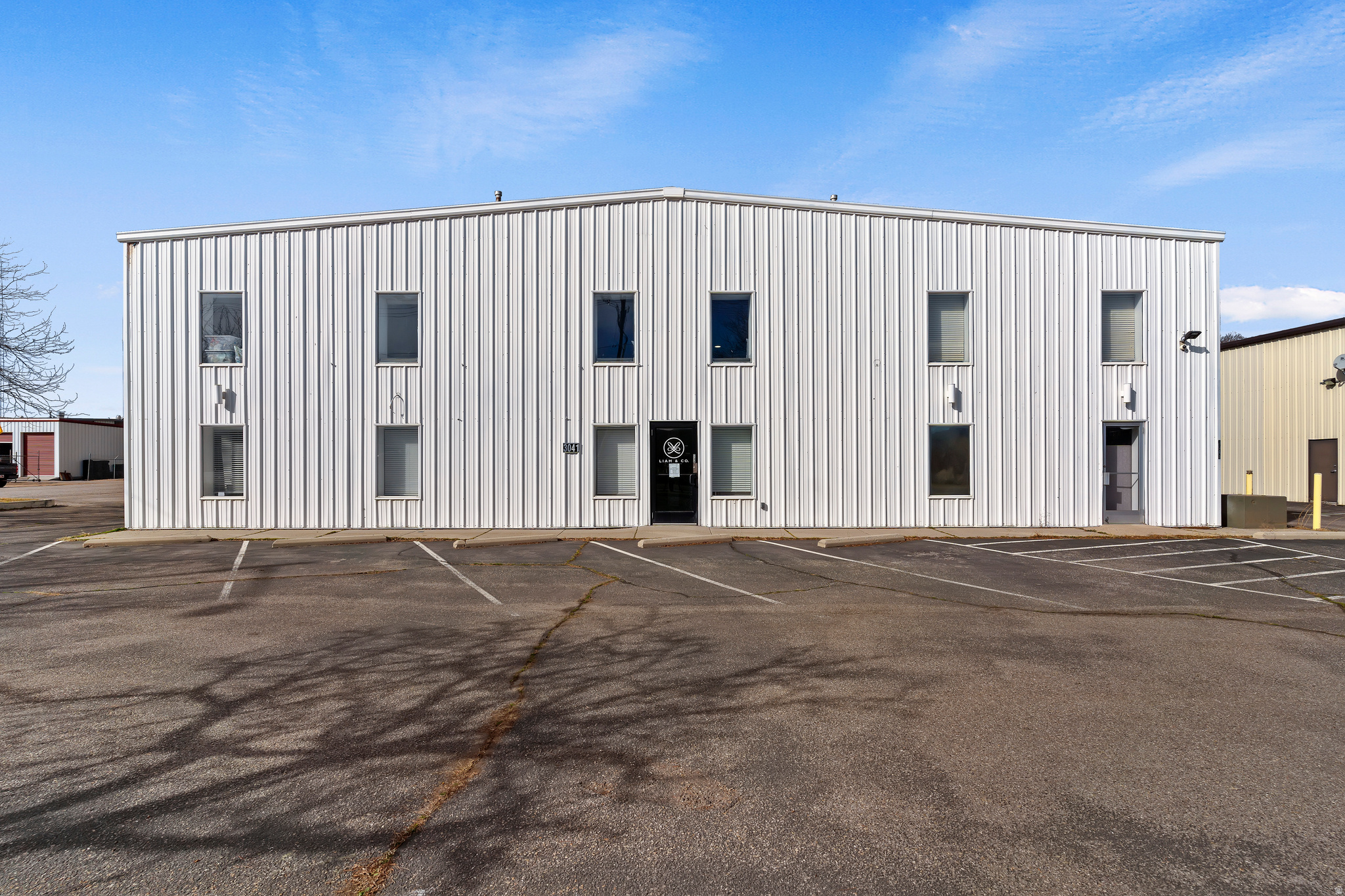This prime flex building offers approximately 10,520 square feet of adaptable space, ideal for a wide range of business needs. Strategically located with direct access to I-15 and I-84, the property ensures exceptional visibility and convenient transportation options for operations of any scale. Inside, you'll find 2,733 square feet dedicated to storefront and office use, complemented by a spacious 3,020-square-foot mezzanine featuring an open area, a full kitchen, and additional office space. The functional warehouse area encompasses 4,767 square feet, and three 12 x 10 overhead doors support efficient loading and distribution processes. Situated in the Edgewood Industrial Park, adjacent to the Ogden Commercial Industrial Park and near Ogden-Hinckley Regional Airport, this property provides an advantageous industrial location. It is zoned Ogden City M-2 Manufacturing and is HUBZone certified, offering further business incentives and opportunities.
