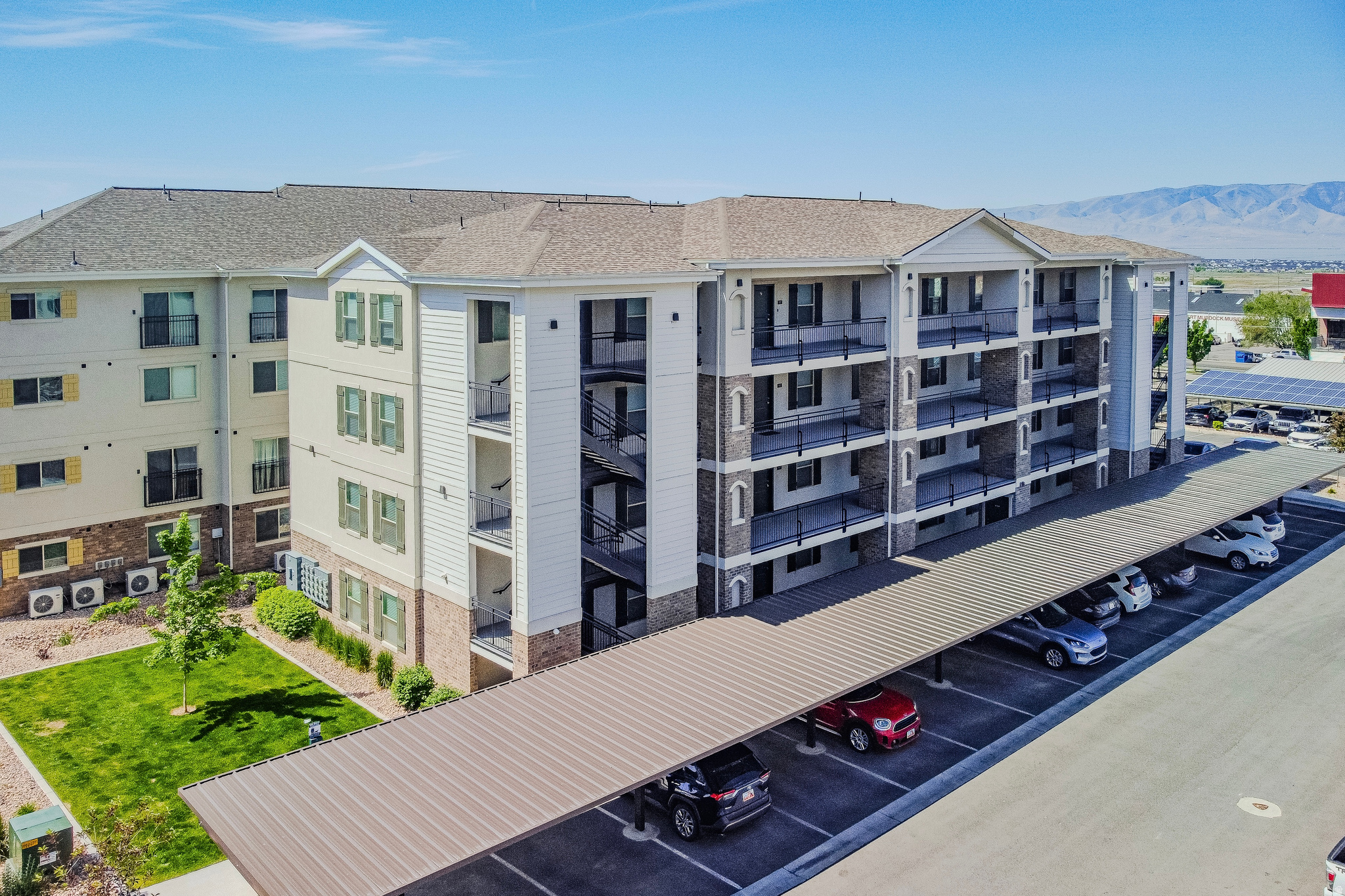 Welcome to this beautifully maintained bottom-floor end-unit condo in Orem, offering comfort, natural light, and thoughtful upgrades throughout. The end-unit location brings in abundant light with additional side windows in the living area and a window above the kitchen sink, creating a bright and inviting feel. The open-concept layout features pendant lighting above the kitchen counter, a stylish dining chandelier, extra recessed lighting above the sink and in the living room, a dimmer switch for adjustable ambiance, and a dedicated wall TV outlet for a clean entertainment setup. Additional shelving in the laundry closet and storage room, along with extra electrical outlets throughout, add practical functionality. Community amenities include open green space, sports courts, and playground areas. This unit also includes one covered parking space and one additional uncovered space. With quick access to I-15, just 7 minutes to Utah Valley University, 15 minutes to BYU, less than 15 minutes to Provo Canyon, and close to shopping and dining, this home is a must see! ***This property also offers strong investment potential, as it includes a lifetime right to rent the unit if it is not owner-occupied. Not all units in the community have rental eligibility, making this a unique advantage. Buyer is advised to independently verify all measurements and property information to their satisfaction