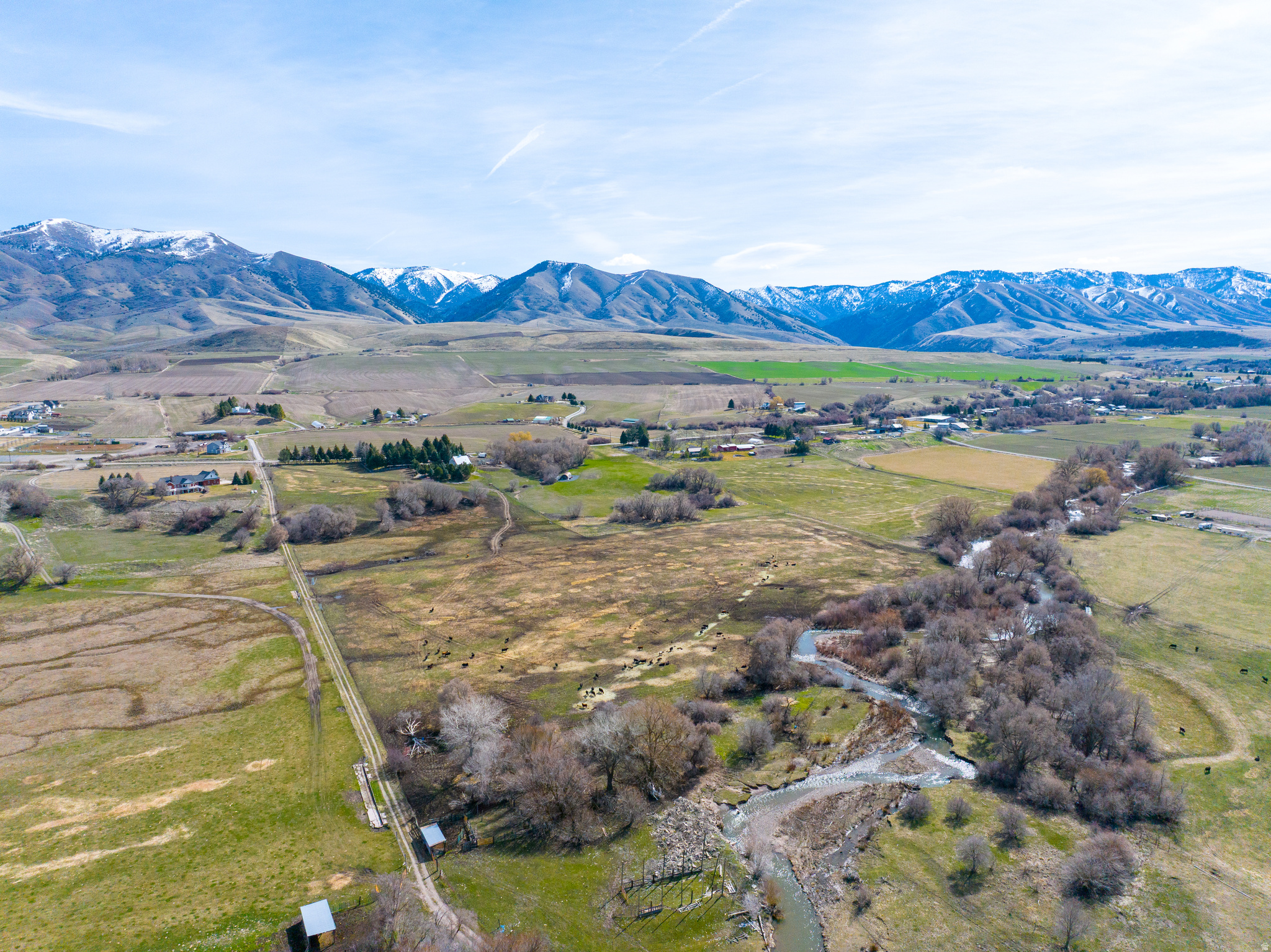 Escape to 26 acres of pristine river front property with incredible mountain views. Ideal for outdoor enthusiasts, this property offers fishing, wildlife watching, and endless recreation right out your back door.  Private, scenic, fully fenced and full of potential for a dream home, cabin, or recreational retreat.  Don't miss out on this rare opportunity to own acreage WITH water shares and gorgeous scenery.