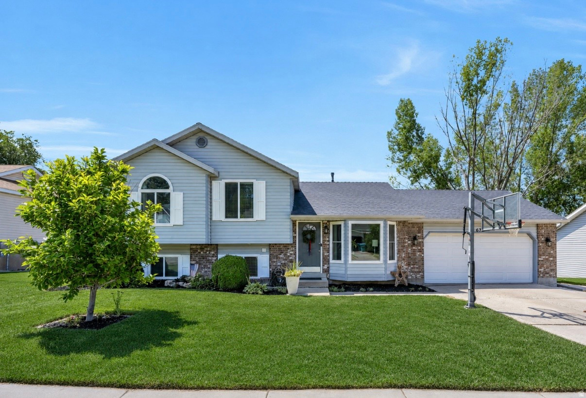 Beautifully Updated Lehi Home with Fully-Finished Outbuilding, Open Field Views & No HOA  Enjoy the perfect blend of convenience and country charm just minutes from I-15, shopping and dining, yet backing to open fields with stunning Mountain Views to the east and west.  This meticulously cared-for newly renovated 5 bdrm/3 bth home features a beautifully remodeled kitchen with new cabinets, quartz countertops, appliances, a large Kohler single-bowl sink and faucet, updated flooring and abundant storage throughout.  Major updates include new windows (2018) and 30-year roof (2015).  Situated on a large lot, step outside to a new spacious paver patio, established landscaping, mature apple and pear trees, and a gorgeous Magnolia tree in the front yard.  A standout feature is the impressive 16' x 24' fully finished two-story barn, complete with mini-split HVAC units on both levels.  Ideal extra square footage for a workshop, studio, home office or exercise/hobby space.  Enjoy peaceful moments watching the neighboring Texas Longhorns graze in the fields behind the home.  As an added bonus, the chicken coop and chickens are included!  This is a rare opportunity to enjoy a peaceful setting without sacrificing convenience.  Lawns and garden treated with Organic MicroRevive soil amendment.  No chemicals!  Square footage figures are provided as a courtesy estimate only and were obtained from county records.  Buyer is advised to obtain an independent measurement.