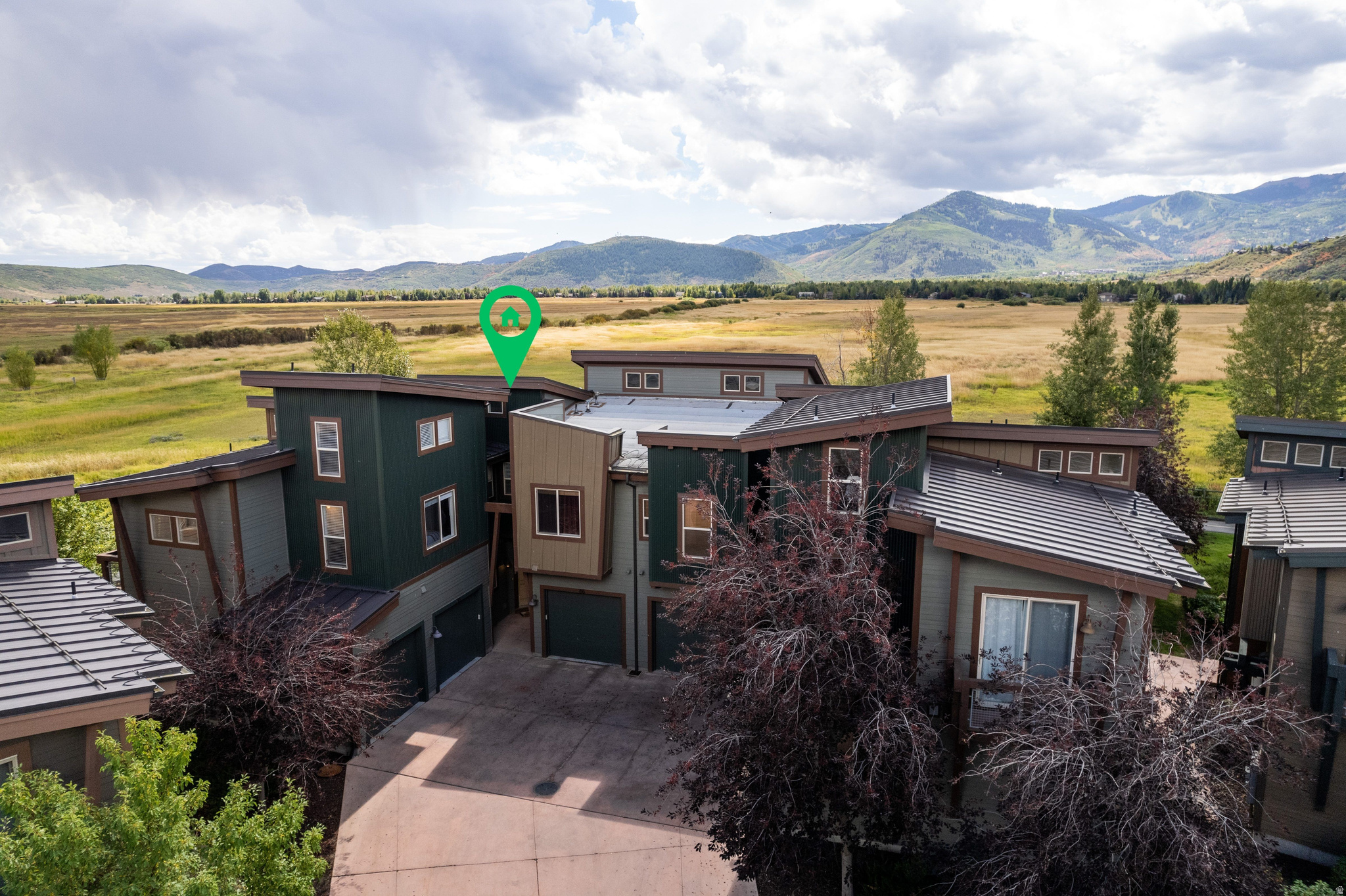 Impeccably maintained and ideally located, this Newpark Residences townhome offers what are arguably the finest ski run and Swaner Nature Preserve views in all of Kimball Junction. The main level features an open-concept living and dining area framed by sweeping preserve vistas, where abundant wildlife and seasonal beauty create a serene backdrop.  Upstairs, the primary suite is a standout, featuring an expansive private balcony overlooking the trail, preserve, and distant ski runs. A versatile loft area and a private guest suite with an additional loft complete a floor plan that lives equally well as a primary residence or a high-performing rental.  The owners have tastefully outfitted the home with a beautiful furniture package that may be conveyed under mutually agreeable terms, allowing the new owner immediate enjoyment of the residence.  Set directly along the NewPark Trail and bordering the 1,100-acre Swaner Nature Preserve open space, miles of outdoor recreation are right outside your door. Leave your car in the private garage and enjoy effortless walkability to Kimball Junction's recreation, dining, shopping, and entertainment - this is where trails, wildlife, and mountain views define everyday living!