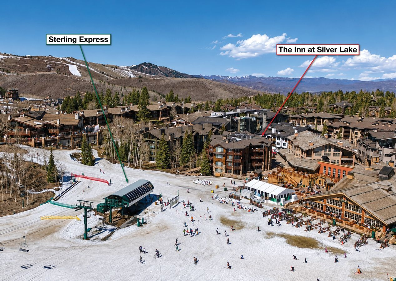 The Inn at Silver Lake holds eight residences, and in the past six years only three have changed hands. Residence #2 is one of just two in the building that walk directly out to the Silver Lake ski beach, with the beach itself framed in the windows. For buyers who know Deer Valley, that is the entire story: the center of the resort, mid-mountain, at the heart of Silver Lake Village, in a building that almost never trades. The position rewrites the ski day. No drive, no shuttle, no staging gear the night before. Boots go on at home, and you are on first tracks on a powder day while most of the mountain is still in line at the base. Lunch happens at your own table. And when the light flattens, the day ends on the main-level deck, barbecue going, hot tub steaming, watching the last runs come down to the beach below. Inside, 3,413 square feet resolve into four bedrooms across two levels, a layout that comfortably accommodates a large family or many guests. The main level carries the social spaces out to the deck, while the lower level gives children and guests their own territory, with a patio of its own. Sleeping capacity is exceptional, whether you are hosting three generations over Presidents' Week or letting the residence earn its keep. The details decide whether a mid-mountain residence actually works: two assigned underground parking spaces, a rarity at Silver Lake, and abundant in-residence storage for the skis, boots, and gear of a family that uses the mountain year-round. A true lock-and-leave, ready the day you land, and asking nothing when you are gone. The building quietly handles the rest. A full-time property manager lives on site, so owners and guests always have someone on hand, and an exercise room, a game room with pool table, ski lockers just outside the residence, and a dedicated ski prep area round out the amenities. The lifts, dining, and aprs of Silver Lake Village sit steps from the door, with Stein Eriksen Lodge, the Goldener Hirsch, and the village's other renowned addresses an easy walk away. Historic Park City Main Street is minutes down the mountain, and Salt Lake City International, with its private terminals, is roughly 35 minutes away. Few ski residences in the West connect a major airport to first chair this quickly.