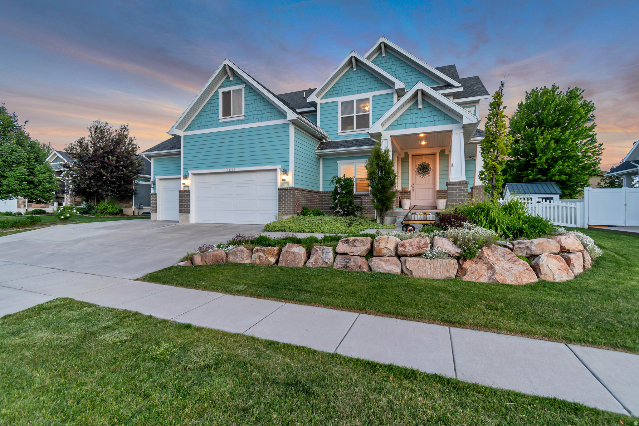 Custom-built home in one of Farmington's most desirable neighborhoods.  Craftsman style home featuring a large covered front porch and beautiful landscaping.  Amazing floor plan with a main-floor den, a huge kitchen featuring upgraded appliances, quality craftsmanship, high end countertops, and beautiful cabinetry.  The large pantry has built in shelving and tons of storage.  Open concept main level family room and kitchen flow together with plenty of space for family gatherings.  Second level features brand new carpet and one of the best floor plans a family could expect.  4 large bedrooms feature built-in shelving in closets plus a bonus family room/ guest room.  Master bedroom features a giant en-suite Master bath, double sinks, garden tub, large shower, private potty room and massive walk-in closet with custom built-in shelving. Large thought-out laundry room close to the bedrooms, has plenty of counter space and the washer and dryer are included.  Basement is partly finished with completed HVAC and partial electrical.  When you're ready to grow into the home, the large space is ready to be finished with 2 bedrooms, a bathroom and a family room.  The space could accommodate a mother-in-law apartment with private entrance and dedicated parking spot.  Fully landscaped yard featuring mature cottage style perennial flower beds across the entire front and side yard. Mature flower beds and trees around the home and a raised bed vegetable garden. Automatic Sprinkler system that covers lawn, flower beds and vegetable garden.  Large covered cement patio perfect for dining, lounging and entertaining. Large open flat backyard, fully fenced with adorable white picket fence and private back fence.  Amazing spacious 4 car garage.  Plenty of room for parking your cars and toys. You will love the ample storage! Well-kept, quiet, beautiful neighborhood in a great school district and located close to shopping, entertainment, and abundant outdoor activities. With-in walking distance of a beautiful new city park and the Rio Grand walking and biking trail. A short 5 minute drive to Station Park, Western Sports Park, Lagoon amusement park and walking trail, Farmington Bay Bird Refuge and Farmington recreation center.