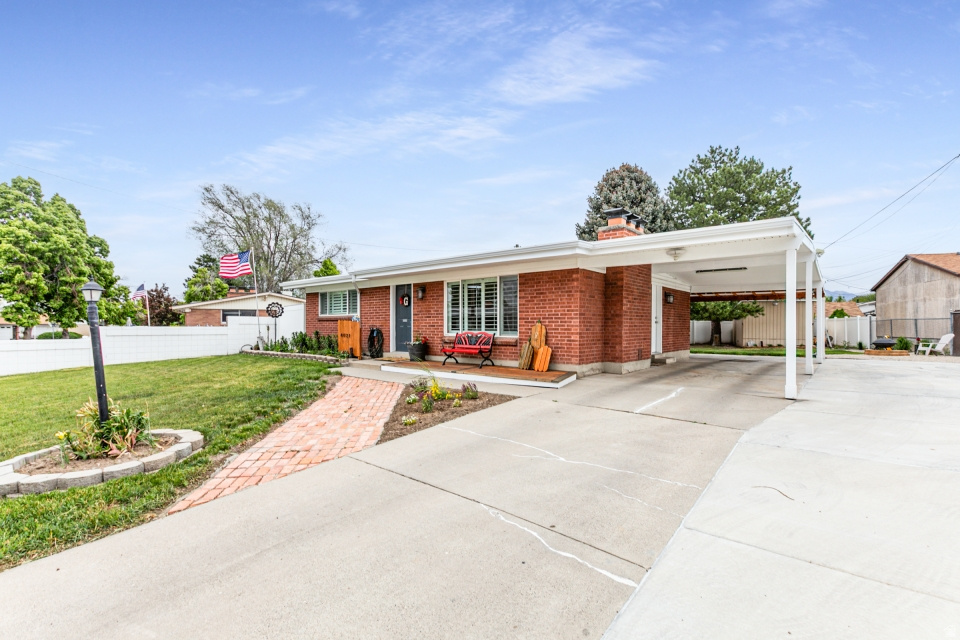 Welcome to this beautifully updated brick rambler nestled in a quiet West Valley neighborhood! This home combines classic charm with modern upgrades, offering both comfort and style throughout. Step inside to find stunning hardwood floors and a fully remodeled kitchen featuring new cabinetry, sleek countertops, a stylish backsplash, tile flooring-perfect for everyday living and entertaining. The updated bathrooms add a fresh, contemporary feel, making this home truly move-in ready. Out back, you'll find the showstopper-a covered rear deck that's built for entertaining.  This space is perfect for hosting gatherings, or simply relaxing after a long day. It's a backyard setup that will be the envy of friends and family. Don't miss the opportunity to own this thoughtfully upgraded home with incredible indoor and outdoor living spaces!  Square footage figures are provided as a courtesy estimate only and were obtained from county records .  Buyer is advised to obtain an independent measurement.