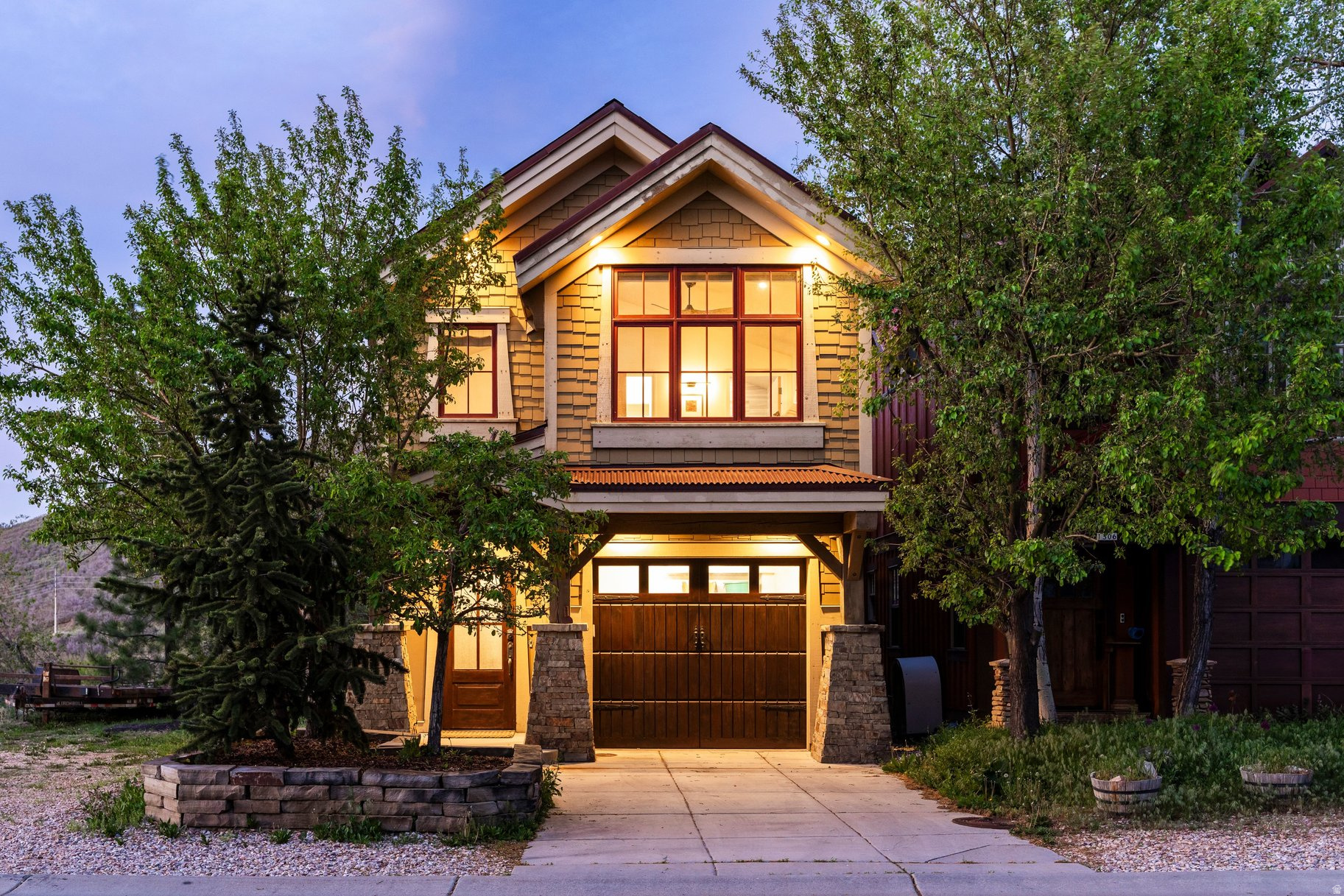 Beautiful Old Town home in a phenomenal location in Old Town Park City, just steps from Park City Mountain Resort and historic Main Street. Recently renovated with a high-end designer touch, this home offers unique style and sophistication. The main level features a spacious great room with high ceilings and a gourmet custom kitchen with functional island that opens seamlessly onto a private deck, providing outdoor living space to enjoy Park City's amazing summers. Upstairs, you'll find a generous ensuite bedroom along with an expansive primary suite boasting a separate soaking tub and steam shower. The lower level includes tall ceilings, radiant heated floors, a comfortable living area, an additional bedroom, and a full bathroom. Situated across the street from Park City Mountain, the home features a practical, spacious layout, a covered entryway, an attached garage, and a level heated driveway. Furnishings are negotiable and this home could be sold turnkey.