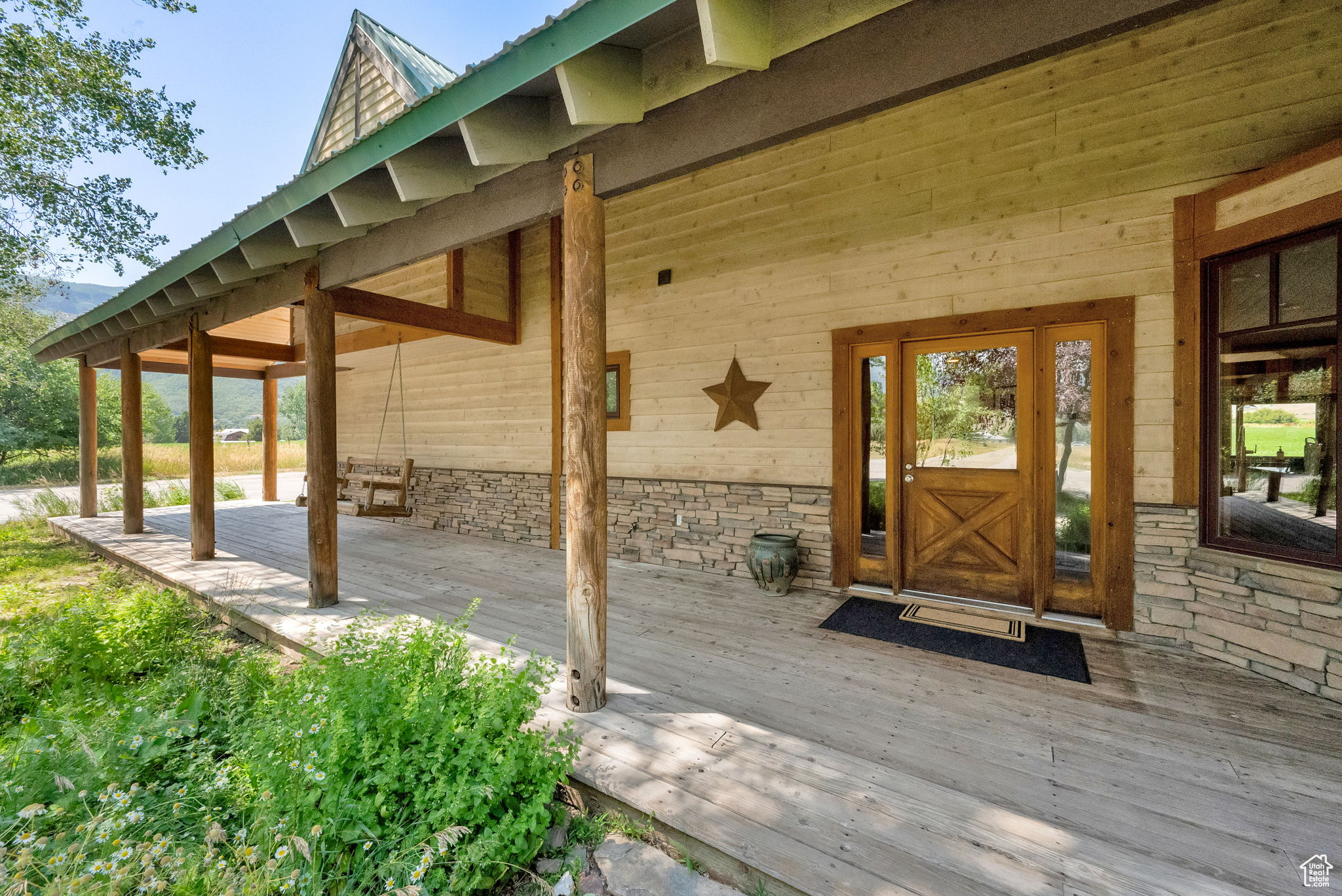 Experience the best of country living and investment opportunity with this stunning Liberty property set on a total of 9.7 acres. The property comprises three parcels: the main home, a 0.49-acre lot (Parcel #22-120-023), and a 6.39-acre parcel (Parcel #22-012-0001) with AV-3 zoning, which has the potential to be developed into two additional lots. The 3,643 sq ft home features four bedrooms, two flex spaces, and a large upstairs family room with incredible mountain and valley views.  A 2,450 sq ft shop with CV-2 zoning offers potential for both business and hobby use. The property also includes 32 shares of Liberty Irrigation water and one share of Liberty Pipeline culinary water. Enjoy peaceful country living with room to grow and invest.