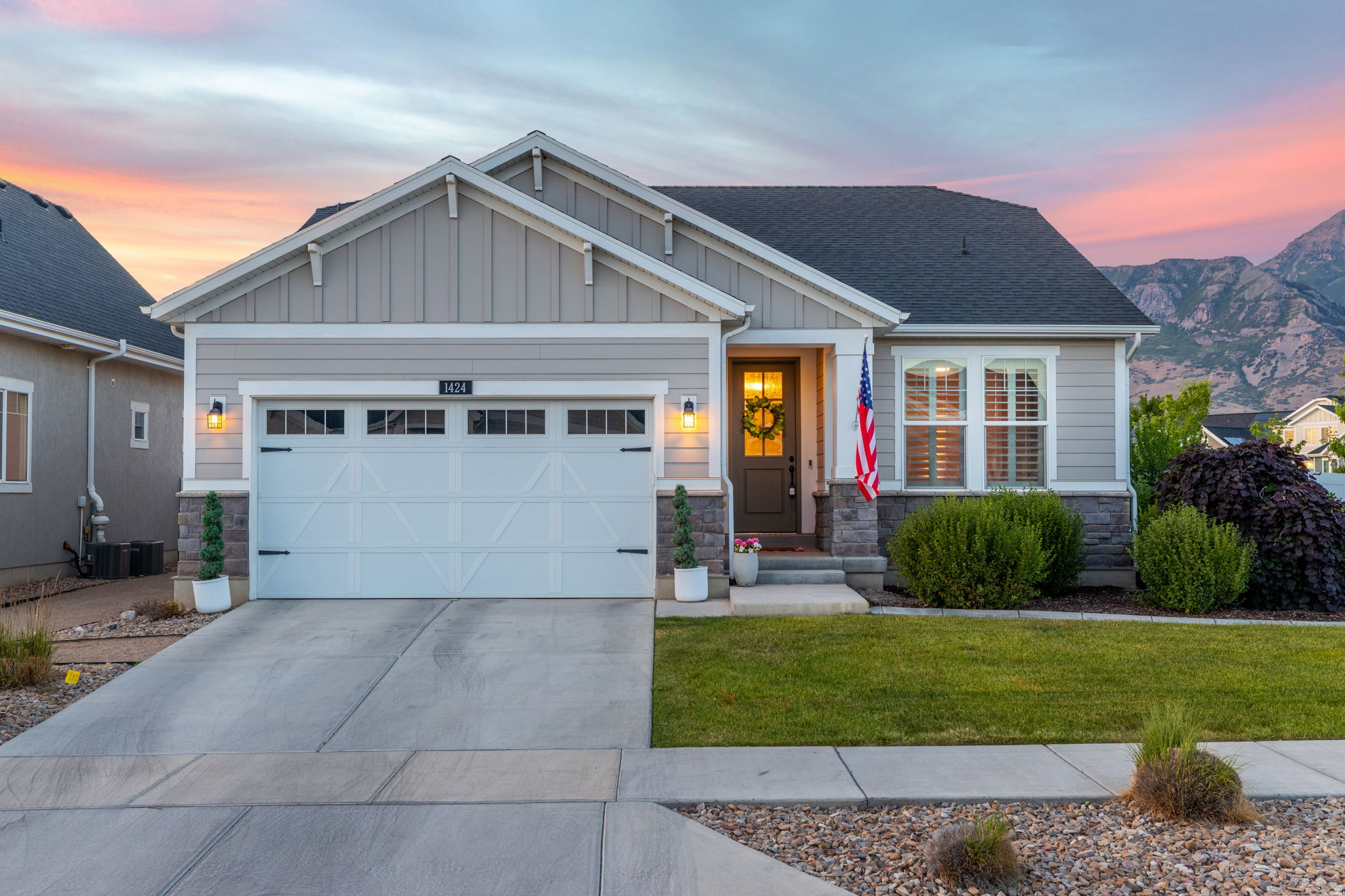 The backyard view of Mount Timpanogos is nothing short of breathtaking. Whether you're enjoying a quiet outdoor breakfast or an evening sunset from the patio gazebo, the mountain backdrop creates a setting you'll never tire of.  Inside, the home is equally impressive. A grand entry welcomes you with 9-foot ceilings, 8-foot doors on the main level, custom trim work, plantation shutters, and upgraded lighting throughout. The beautifully appointed kitchen features a gas range, custom cabinetry, an Avillano honed marble backsplash, abundant storage, a dedicated wall of cabinetry in the semi-formal dining area, and an additional pantry cabinet conveniently located near the laundry room. The primary suite offers thoughtful upgrades, including a barn door leading to the ensuite bath, a bidet, and a mounted television that will remain with the home. Throughout the house, shiplap and bead board accent walls add warmth, character, and timeless style.  Comfort and functionality continue downstairs, where every bedroom features a ceiling fan, and all bathrooms are equipped with bidets. The fully finished basement offers a spacious family room, supplemental heat sources in every room, and through-wall ventilation fans, providing year-round comfort. Additional peace of mind comes from the professionally installed radon mitigation system. Outside, the xeriscaped front yard with concrete curbing and a glass-inset front door creates beautiful curb appeal. The fully fenced backyard includes gates on both the east and west sides, offering convenience and accessibility. This home combines thoughtful upgrades, exceptional functionality, and unforgettable mountain views-an opportunity that's truly special. Buyer's broker to verify all information. Square footage obtained from building plans.