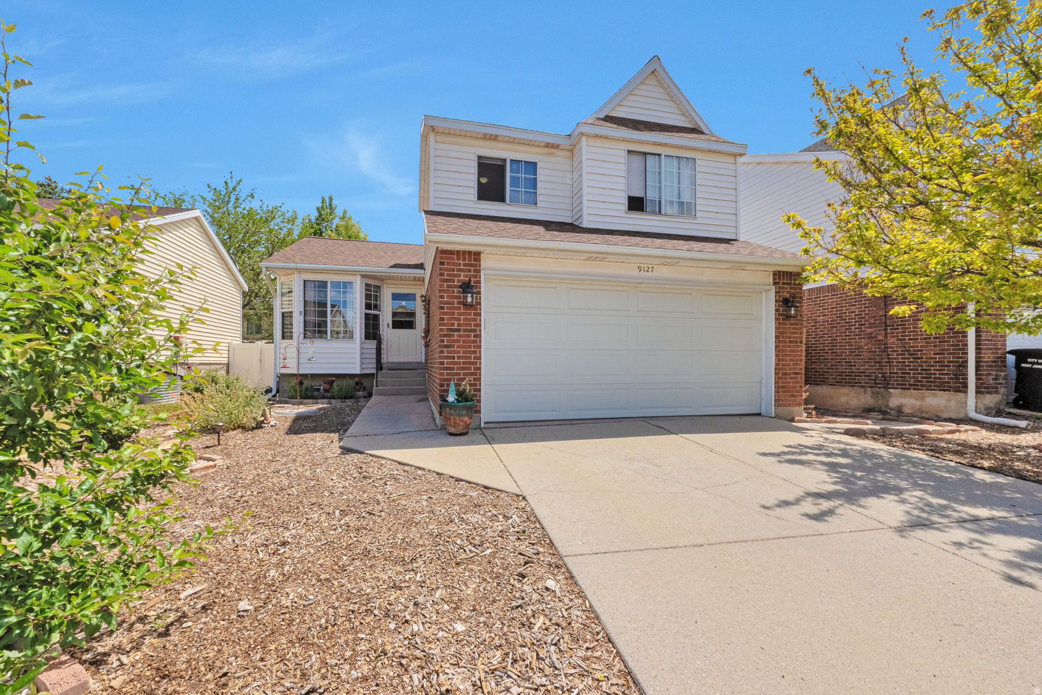 Welcome to this warm and well-loved West Jordan home. Enjoy the convenience of being ideally located in a quiet, established neighborhood, near parks, schools, shopping, and easy freeway access. Love the open feel, vaulted ceilings, and comfortable living spaces. The yard has been a labor of love with favorite plants and flowers, including Iris, Peonies, and Lilac. The peach tree is very giving and yummy!  The front and side yards invite butterflies, bees, birds, and occasional quails, ducks, and squirrels. The yard has been landscaped to be water-wise and easily maintained. Sit on the comfortable back deck and listening to the bird songs. When it gets colder enjoy a nice fire in the fire pit with plenty of room for friends and conversation.  Great neighborhood with very little traffic, especially in this dead end cul-de-sac.  6 year old roof and 5 year old furnace and AC.  Make an appointment and come and see today!