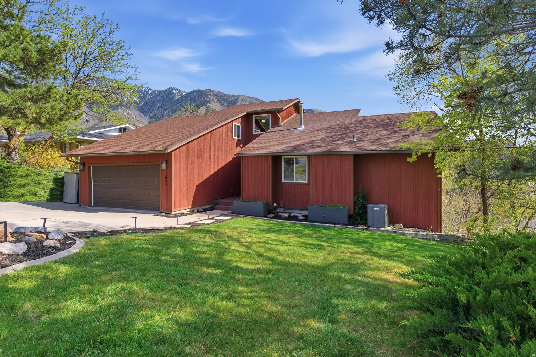 Huge Price improvement! Set in the East Sandy foothills, this rare wooded 0.40-acre property offers privacy that is increasingly hard to find, with no neighbor on one side, a private stream, direct trail access, and beautiful mountain and valley views. Three expansive decks and two private stream-side patios create a true mountain retreat feel, just minutes from Big and Little Cottonwood Canyon and 23 minutes from the ski resorts. The 5-bedroom layout offers flexibility for a primary residence, guest space, multi-generational living, or a lower-level mother-in-law unit with separate entrance. The property offers rental potential on a standalone or owner-occupied basis, with historical short-term/Airbnb income of up to $6,000/month during peak season. A unique lifestyle property in one of Sandy's most desirable foothill locations. Major system updates include new windows (2023), water heater (2021), and furnace (2025).