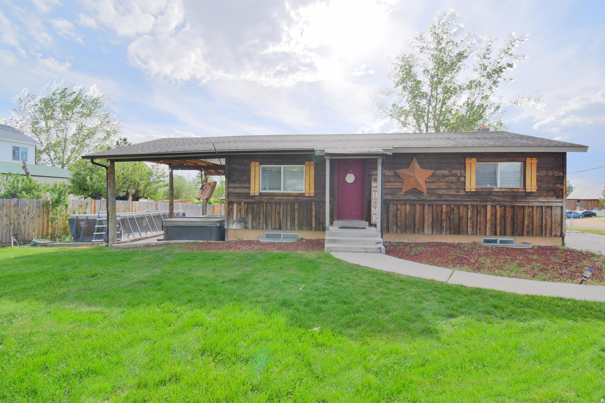 Rustic charm meets modern updates in this beautifully remodeled rambler on a spacious corner lot in the heart of Mt. Pleasant. This 3-bedroom, 2-bath home features updated flooring, trim, lighting, windows, and a refreshed kitchen with warm wood cabinetry and stainless appliances. The fully finished basement includes a theater/family room and separate basement entrance for added flexibility.  Step outside to enjoy the large covered patio, hot tub area, mature shade trees, RV parking, and landscaped yard. The detached matching shed/shop with power adds great storage or hobby space. Plenty of room for entertaining, relaxing, or parking all the toys.  Additional features include central air, high-efficiency heating, sprinkler system, covered patio, mountain views, and extra parking. Conveniently located near schools, parks, and outdoor recreation.  Square footage figures are provided as a courtesy estimate only and were obtained from an appraisal.  Buyer is advised to obtain an independent measurement.