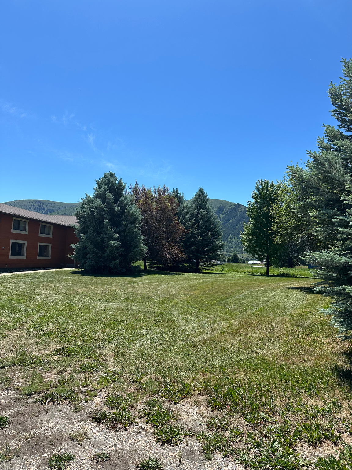 **3767 E. 4100 N., Liberty, Utah - 28.65 Acres of Boundless Possibility** Nestled in the heart of Liberty, Utah, this exceptional 28.65-acre property presents a rare opportunity to own a sprawling mountain retreat with virtually limitless potential. Spanning five separate parcels and zoned AV-3, this is the kind of land that invites you to dream big - whether you envision a private family compound, a custom-built estate, or a thoughtfully planned rural community surrounded by some of the most breathtaking terrain in the Ogden Valley.  Few properties in the area can match this combination of scale, infrastructure, and location. The land comes with 1 culinary water share through Liberty Pipeline, associated with the existing single-family residence, along with an impressive 94.5 secondary shares with Liberty Irrigation - a substantial water portfolio that dramatically enhances the property's development flexibility and long-term value. Electric and gas utilities are already available on site, and the property is currently served by septic, providing a solid foundation for future build-out.  Step outside and take in gorgeous, unobstructed views of Nordic Valley stretching across the landscape. A short walk brings you to Liberty Park and the historic Liberty cemetery, grounding you in the quiet charm of this tight-knit mountain community. Yet for all its serenity, the property sits just minutes from world-class recreation. Pineview Reservoir offers summer boating and fishing, while Powder Mountain, Snowbasin, and Nordic Valley ski resorts deliver legendary powder and alpine adventure throughout the winter months. Prime mountain biking and hiking trails are practically at your doorstep, making this a true four-season destination.  Properties of this size, with this depth of water rights and this proximity to year-round outdoor recreation, almost never come to market in Liberty. This is your chance to secure a legacy piece of land and build exactly the life you've been imagining. Don't let it pass you by. (Listing includes five parcels; 22-013-0022, 22-013-0021, 22-010-0045, 22-010-0050, 22-010-0052)
