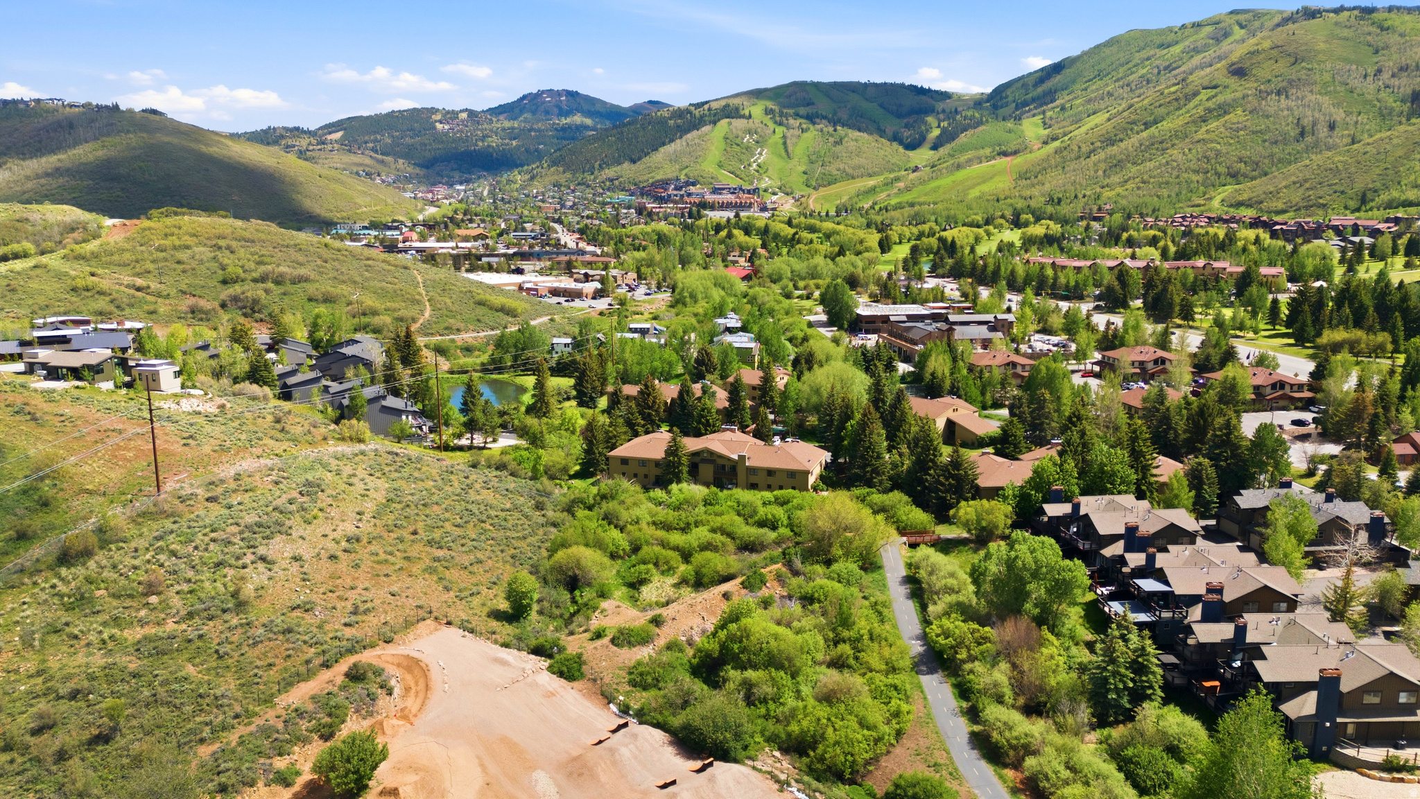 One of Park City's most desirable in-town locations, where convenience and peaceful surroundings come together. This well maintained 2-bedroom, 2-bath residence is located in a park-like setting, while remaining close to everything Park City has to offer. Step outside to your private patio, where you'll enjoy mature trees, open space, and a seasonal stream--an ideal setting for morning coffee, outdoor dining, or simply relaxing. Inside, the open floor plan provides comfortable living spaces and easy single-level living.  Located just a short walk from neighborhood restaurants, cafs, and shops, this home also offers immediate access to Park City's extensive network of paved bike paths and trails, connecting you to hundreds of miles of world-class recreation right from your doorstep. Additional features include a private one-car garage, all new windows, gas fireplace, community swimming pool, and pickleball court. Whether you're looking for a full-time residence, mountain getaway, or investment property, this Windrift condo offers an exceptional opportunity to enjoy the Park City lifestyle.