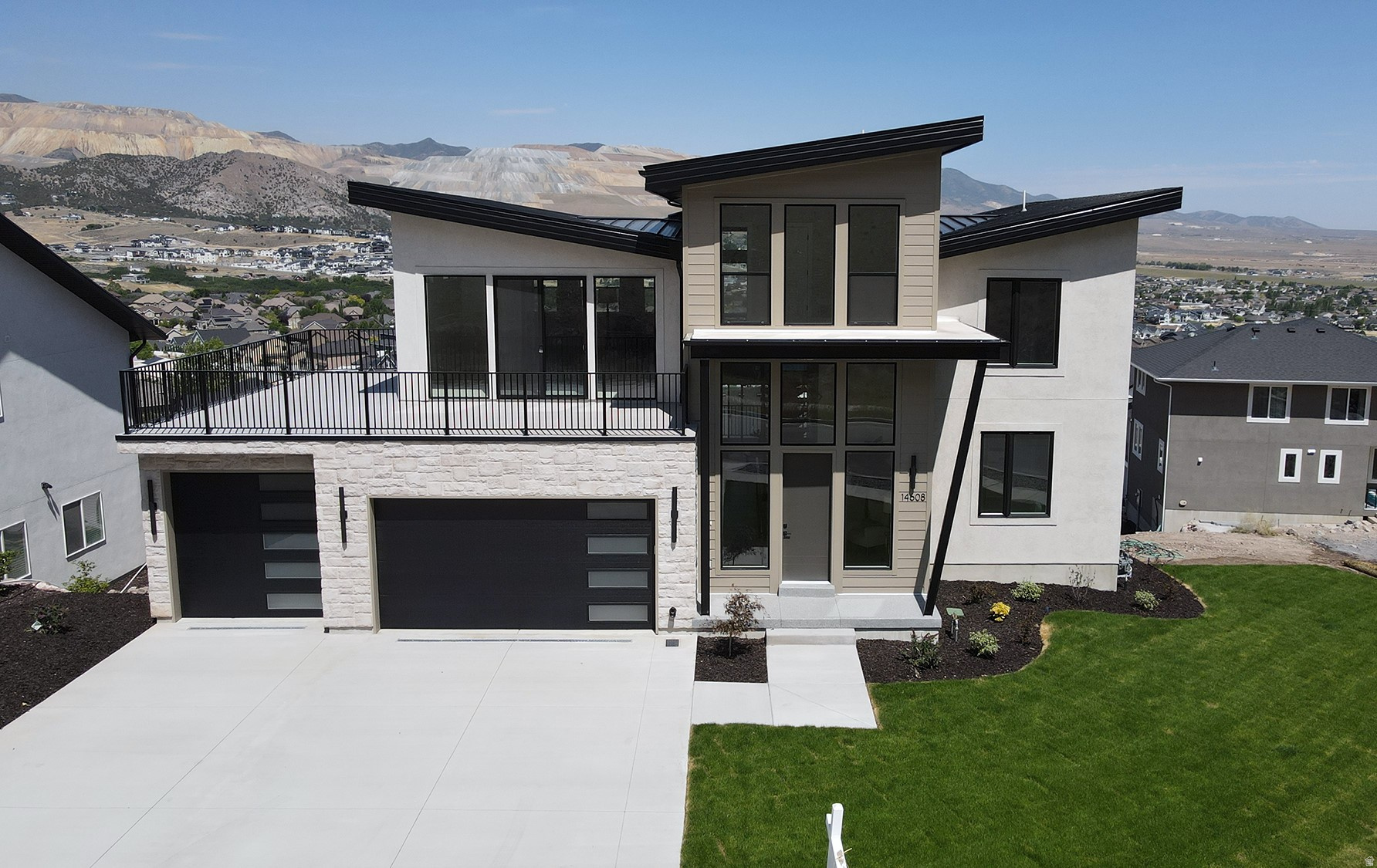4 beds. 3 baths. Possible 6 beds, 4 baths. 5,251 sqft. on 2 levels in Herriman. Amazing views AND flat backyard. Best square foot price on Wyatt Run. This home earns its place.  Because at $1.55M with over 5,250 square feet of 2025 new construction on a hillside in Eastridge Herriman - with unobstructed views of both the Wasatch Range and the Oquirrh Mountains - this is not a home that needs to apologize for its price. It needs to explain its value. So here it is. The main floor is built for the way people actually live - not the way spec sheets get written. Open great room. Elegant finishes. A kitchen and dining layout that connects without friction to the living space. Large windows that frame the surrounding valley and mountain scenery on two sides. Main-floor living means the primary bedroom, the kitchen, the spaces you use every day are all on one level. That is a design decision. At 5,251 square feet, it matters. Then there's the lower level - and this is where the conversation gets interesting. The basement is framed for a potential ADU-style configuration: 2 bedrooms, 1 bathroom, a living area, kitchen, laundry, and a separate entrance. Subject to buyer verification and local requirements, that is a finished lower level that most $1.5M homes in this market are still calling "future potential." Here, it's already a floor plan. Extended family. Long-term guests. Future rental income. The optionality is built in - literally. The address is Eastridge Herriman - the hillside community at the southernmost end of the Salt Lake Valley, elevated above the inversion layer, above the valley noise, with the Wasatch behind you and six ski resorts within 45 minutes. Silicon Slopes in twenty. Mountain View Corridor five minutes south. Blackridge Reservoir five minutes away. Sixty miles of Herriman trail access from the community edge. And compared to the other Wyatt Run luxury listings? This one is larger than both - and priced lower per square foot than either.