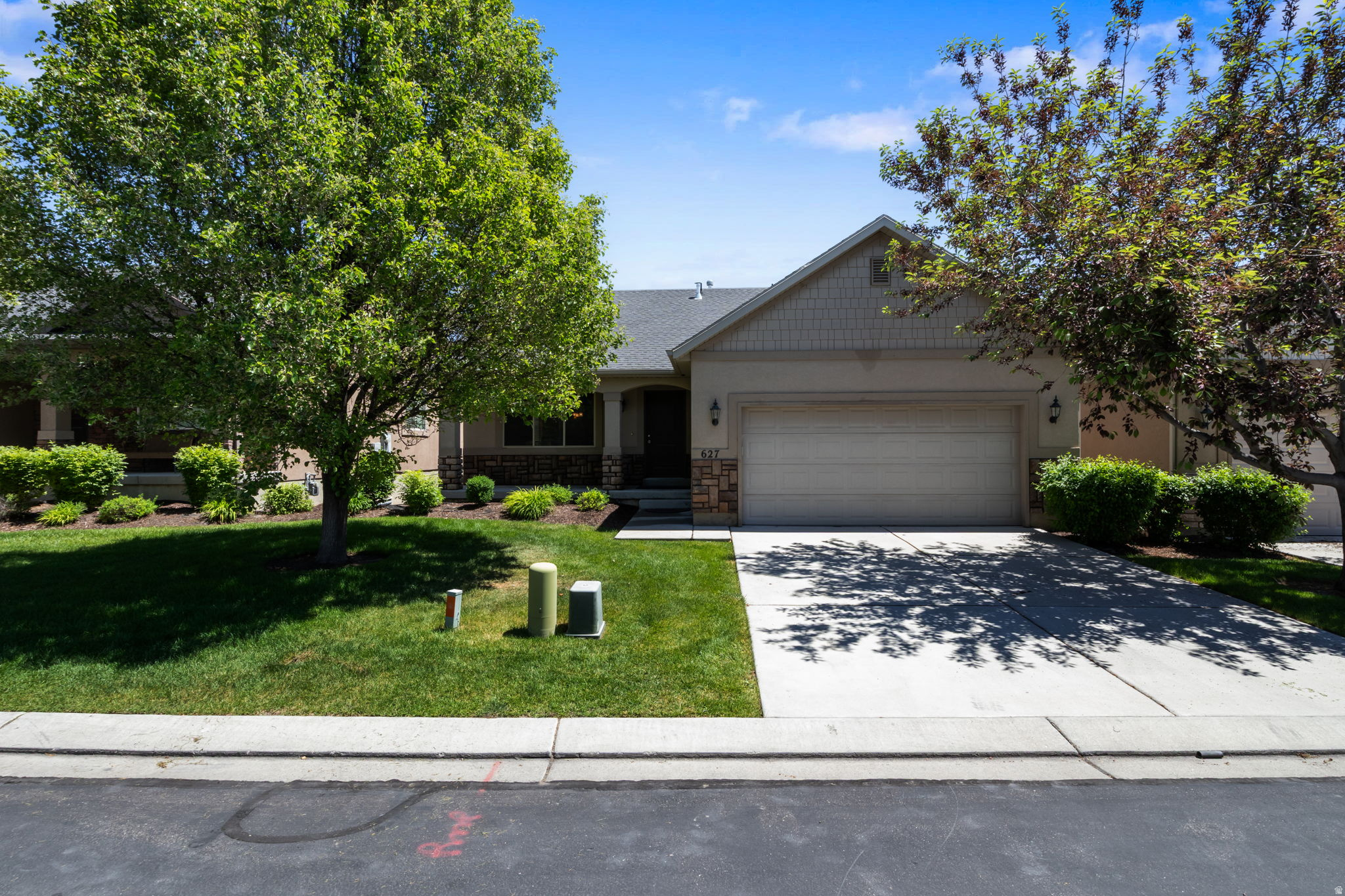 Experience comfort and style in this beautifully maintained Orem home. Perfectly located a seven minute walk from Sleepy Ridge Golf Course and minutes from the tranquil shores of Utah Lake. This property offers a peaceful lifestyle with quick access to Vineyard Elementary and Lakeside Soccer Park. The interior features vaulted ceilings, creating an open and airy atmosphere throughout the main living areas. An unfinished daylight basement provides the perfect opportunity to customize the home to your needs, whether you want a home theater, gym, or extra bedrooms. Enjoy stress free living as the HOA handles all lawn care, snow removal, and yard maintenance. Residents also have access to an extra large communal backyard, ideal for gatherings and play without the hassle of upkeep. This home offers the perfect balance of quiet neighborhood living with close access to shopping, dining, and essential services. All information, figures, and documentation provided as a courtesy, buyer to verify all information.