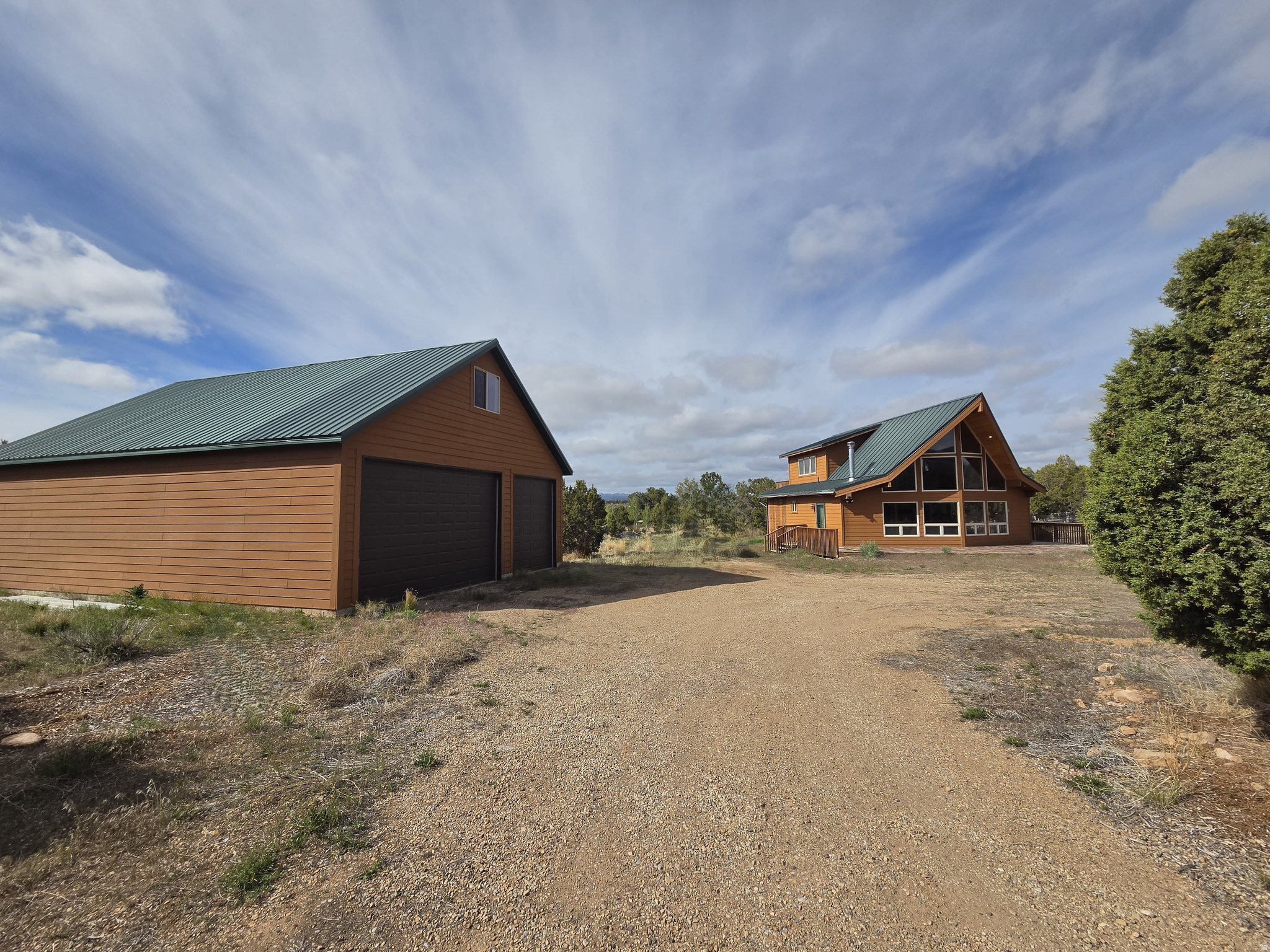 * Don't miss this amazing cabin on 5 Acres in Bandanna Ranch INCLUDING a HUGE 6 car shop/garage!! Fully furnished & ready for all your mountain dreams! * Less than 30 minutes from Strawberry Reservoir, Current Creek & Starvation plus Red Creek is down the dirt road! * Home features beautiful slate tile flooring & tile baths! * Custom Log Beams & Stairs! * This unique cabin has a beautiful large loft for a master bedroom with a full bath & private 2nd story deck overlooking the spectacular mountains with stunning views! * Full wall windows in living room with lots of natural light and a cozy wood-burning stove! * A bedroom and full bath downstairs with a good size laundry room * Updated kitchen with knotty alder cabinets, countertop bar & all appliances included! Plus an extra freezer! * More than enough room to store all the toys or the camper in the garage AND extra space above the garage with new carpet for a perfect man-cave, party room or sleeping space for the guests!! * Very large deck out front, tons of large trees for seclusion, chicken coop and shed! * This property is very private, can't see the cabin from the driveway & the back of the property overlooks the red rock mountains, has tons of boulders/trees with a 4wheeler trail down the back!! * HOA maintains the roads for year-round access with very low fees! Tons of biking, hiking & ATV trails nearby! * Perfect vacation home, hunters dream or fisherman's paradise with low maintenance for year-round & retirement living! * City water, Power, Septic & Propane all connected! * Square footage figures are provided as a courtesy estimate only and were obtained from county records . Buyer is advised to obtain an independent measurement.