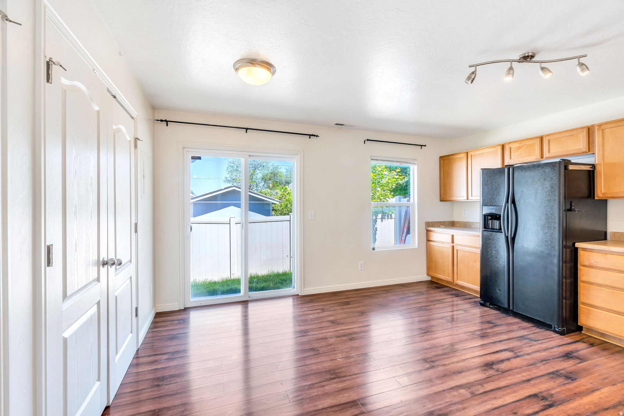 Price reduced!!! Charming townhome located in a secure gated community! The main level features beautiful laminate flooring. The spacious kitchen overlooks the inviting family room, making it perfect for entertaining and everyday living. Enjoy abundant storage throughout the home, including a convenient storage closet on the back patio. Ideally situated within a half-mile walking distance to the TRAX station, movie theater, Chinatown, and a variety of restaurants. Easy freeway access and a quick commute to downtown make this location incredibly convenient. New paint, new blinds, and new carpet!
