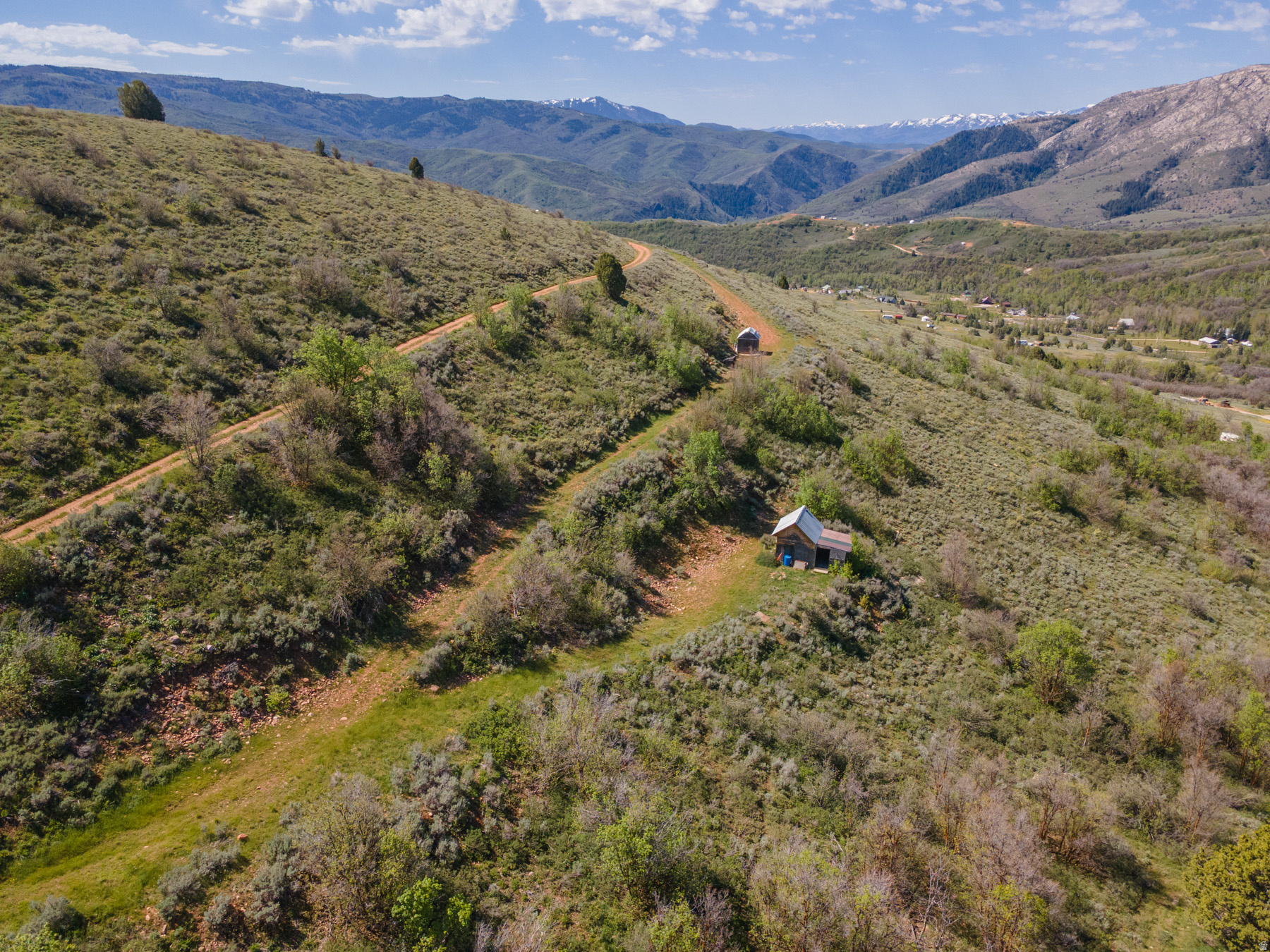 This elevated 2.71-acre lot is a true getaway, offering sweeping mountain views, miles of nearby trails, and a ready-to-use shed for outdoor fun. Perfect for a family campsite retreat or a place to store gear and toys, this property invites you to unplug, explore, and create unforgettable summers.  Escape to your own mountain retreat just a short drive from Causey Reservoir, Monte Cristo, and the scenic Ogden Valley.  Key features: - Size and setting: 2.71 acres of elevated terrain with spectacular mountain views - RV and camping ready: room for 1 large RV pad, ideal for toy haulers and family camping - Driveway in place: easy access onto the lot and parking for multiple vehicles - Storage and outbuilding for equipment and gear - Location, location, location: close to Causey Reservoir, Monte Cristo, and the greater Ogden Valley for endless outdoor adventures - Proximity to water recreation: just 20 minutes to Causey Reservoir and 25 minutes to Pineview Reservoir - Build-ready potential: if you decide to build a cabin or home, you would need a water source and septic in place (not currently in place)  What makes this property special: - An elevated site that feels private yet is easily reachable for weekend getaways - Wide-open space to spread out, camp, and enjoy the fresh mountain air - Walk the property to fully appreciate the views and terrain  Important notes: - Sign on the property for easy identification - There is no cell service in the area; plan accordingly for communications - Water and septic are not currently in place if you plan to build  Bring your toy haulers, your hiking boots, and your sense of adventure. This is the perfect spot to make summer memories and use as a family campsite retreat. Feel free to walk the property and envision your own mountain sanctuary.  Call today to schedule a walkthrough or to get more details. This elevated recreational lot won't last long!  The lot next door, 3325 N Oak Canyon Rd is also for sale by the same owner.