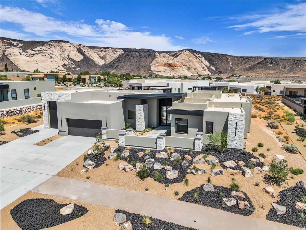 Welcome to this brand-new luxury home in the Ledges, offering breathtaking views and elevated desert living at its finest. Thoughtfully designed with expansive windows that flood the home with natural light. The open concept layout showcases beautiful hardwood flooring, custom cabinetry, high ceilings, wood beams and more! Quality attention to detail throughout! The primary suite is a true retreat with fireplace, complete with a spa inspired bathroom featuring an oversized walk in shower. Each guest bedroom includes a private bath for added comfort and privacy. Step outside to your desert oasis with a private pool & spa. This exceptional property offers the ultimate living luxury living experience.