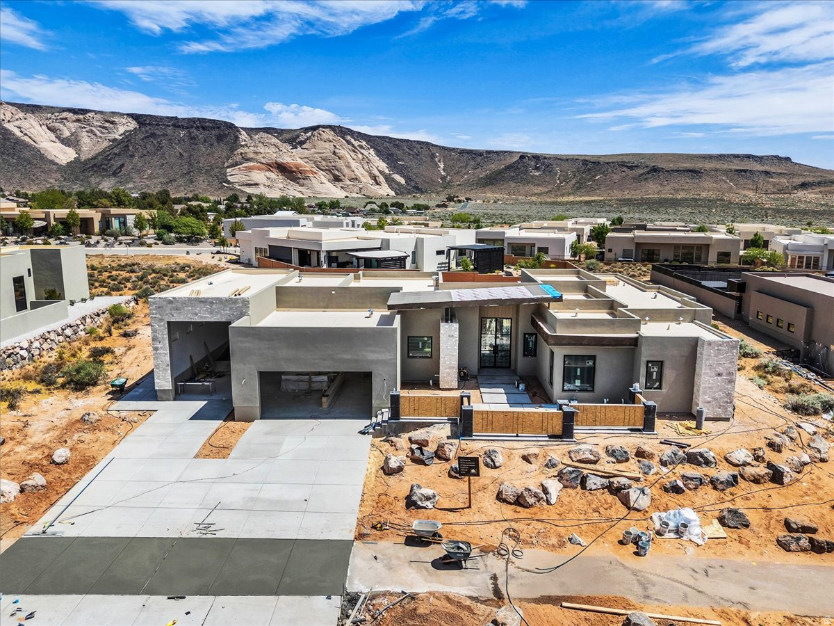 Welcome to this brand-new luxury home in the Ledges, offering breathtaking views and elevated desert living at its finest. Thoughtfully designed with expansive windows that flood the home with natural light. The open concept layout showcases beautiful hardwood flooring, custom cabinetry, high ceilings, wood beams and more! Quality attention to detail throughout! The primary suite is a true retreat with fireplace, complete with a spa inspired bathroom featuring an oversized walk in shower. Each guest bedroom includes a private bath for added comfort and privacy. Step outside to your desert oasis with a private pool & spa. This exceptional property offers the ultimate living luxury living experience.