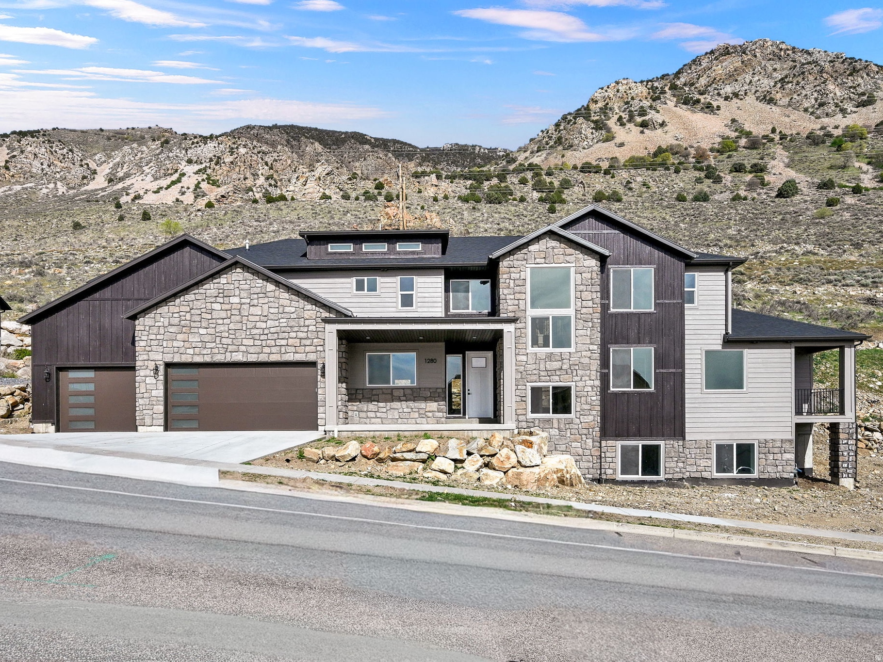 BACK ON THE MARKET!! SALE FAILED AT NO FAULT TO THE SELLER!! Cannot beat the price per sq ft on this fully finished home!! Beautiful new construction ready for its owners! This home has so many amenities, you don't want to miss out. Stainless steel appliances, butler's pantry with sink and space for additional refrigerator, luxury vinyl flooring throughout, sink in laundry room, beautifully tiled master bath with separate soaker tub and shower with frameless glass. The master suite boasts a large walk-in closet, a personal balcony, and a walkout on to the patio with gorgeous mountain views. Don't miss out on this beautiful mountain home.