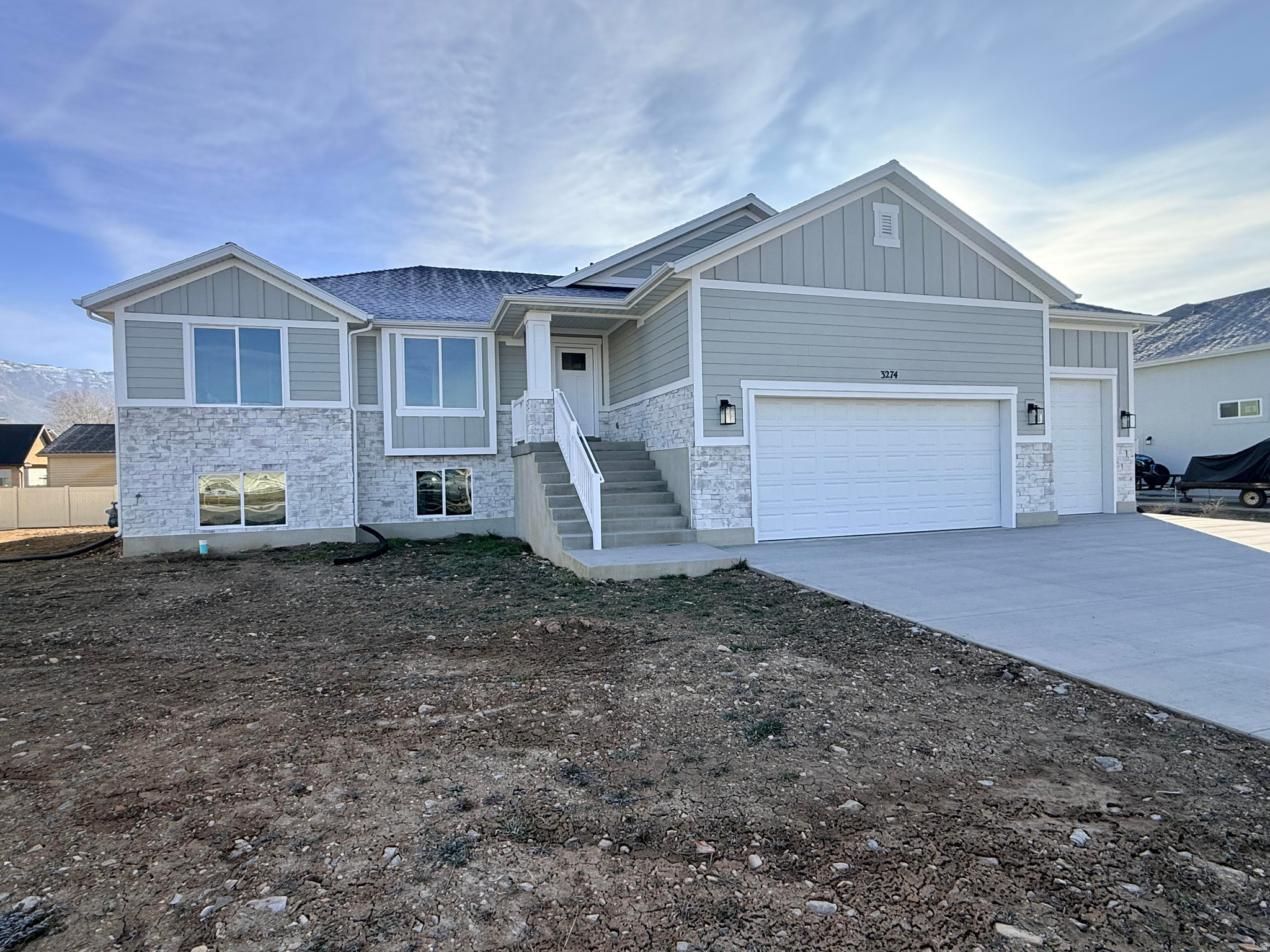 Stunning brand-new 5-bedroom, 3-bath home situated on a spacious 1/3-acre lot. This beautifully designed residence features custom cabinetry, quartz countertops, a cozy fireplace, and an oversized 3-car garage. The full walk-out basement offers exceptional room to grow and can be finished to fit your needs-available for an additional $49,000 without a kitchen or $79,000 with a fully finished basement including a kitchen. A perfect blend of style, space, and comfort, this home is ideal for both today and the future.