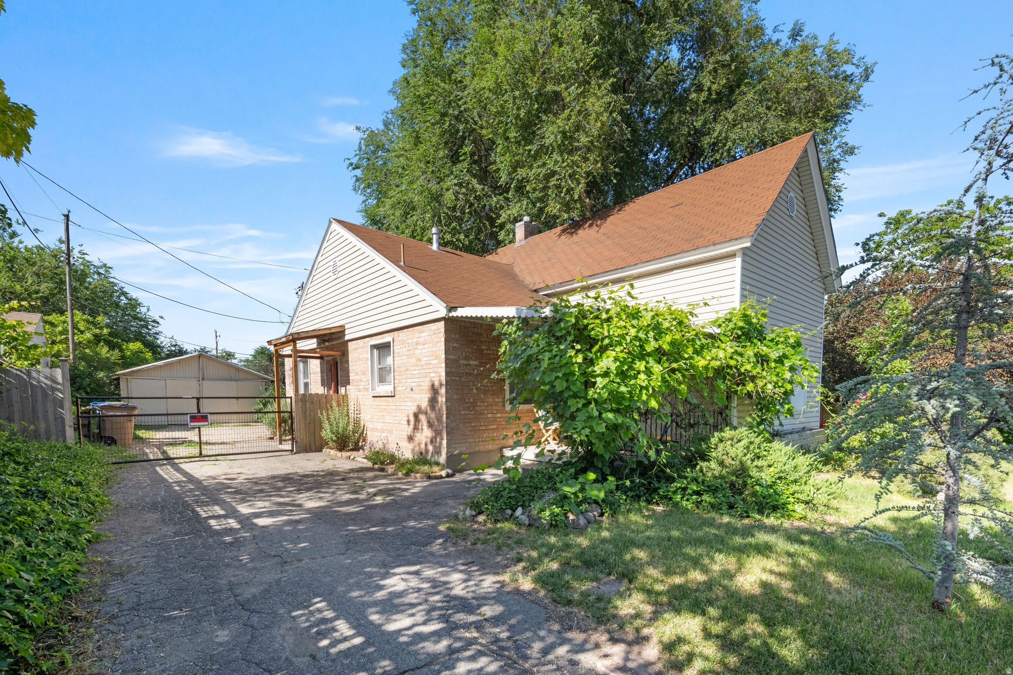 Tucked back from the street on a rare .34-acre lot in South Sugar House, this charming 1921 home offers a unique combination of character, privacy, and opportunity. Surrounded by mature landscaping, fruit trees, established perennials, mint, and rhubarb, the property feels more like a hidden garden retreat than a typical city lot.  Inside, abundant natural light fills the home, complementing the updated kitchen and inviting living spaces. The main level features a spacious primary bedroom, a full bathroom, and an additional room that works beautifully as a guest room, office, nursery, or creative space.  Upstairs, a distinctive loft opens to a private deck nestled among the trees, creating the perfect space for a home office, reading retreat, art studio, or additional living area. The basement stays naturally cool throughout the warmer months and includes a second bathroom, generous storage, and flexible space for hobbies, projects, or everyday living.  Beyond the home itself, the oversized lot offers room to dream. Whether you're envisioning expanded gardens, outdoor entertaining spaces, a workshop, a substantial garage project, or exploring future development opportunities, this property provides flexibility that is increasingly difficult to find in one of Salt Lake's most desirable neighborhoods.  Rich with history, filled with natural light, and set on a truly exceptional lot, this is a property that offers both immediate enjoyment and long-term potential.  Square footage figures are provided as a courtesy estimate only and were obtained from county records.  Buyer is advised to obtain an independent measurement.