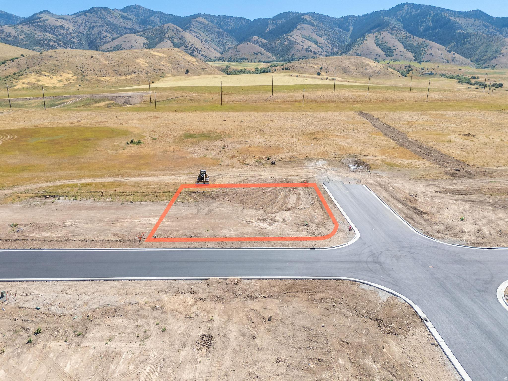 Build your Cache Valley home on this 0.30-acre corner building lot at 110 N 1140 E in Hyde Park, UT 84318. Set in the Juniper Ridge community on the Hyde Park east bench, this flat, easily buildable homesite captures valley and mountain views with excellent corner-lot presence and quick access to Logan, USU, parks, trails, and canyon recreation. You can face your home either west or south with this lot and a side load garage is possible!